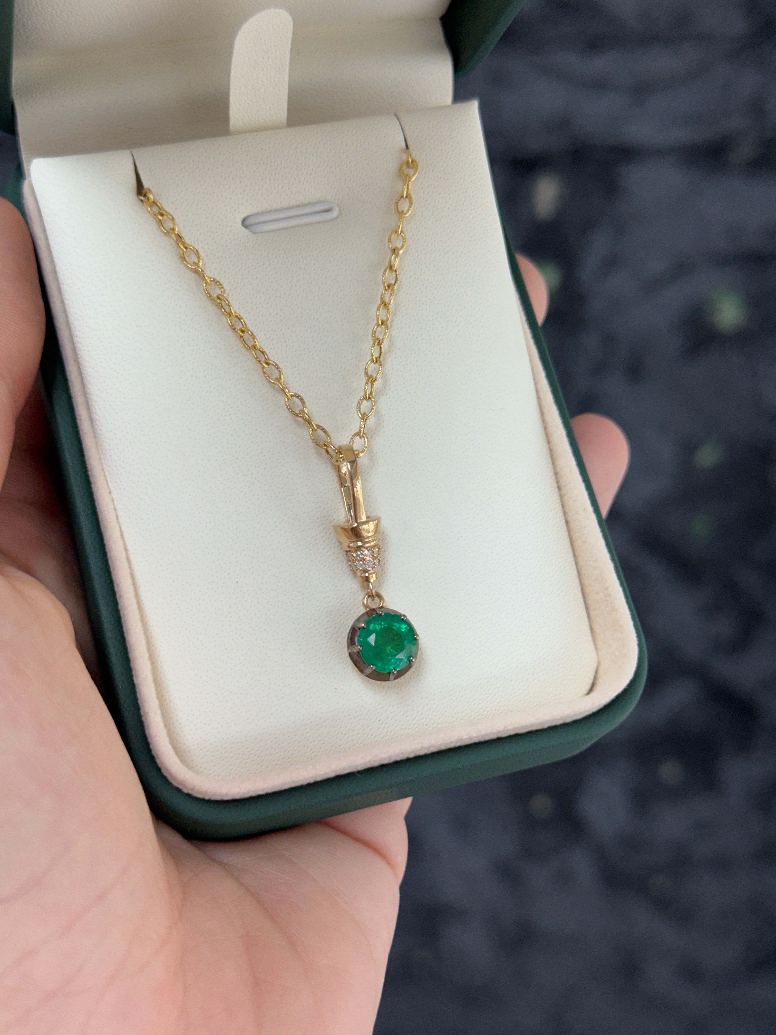 14K gold emerald pendant necklace with round cut gemstone, multi-prong setting, and diamond accents, by JR Colombian Emeralds.
