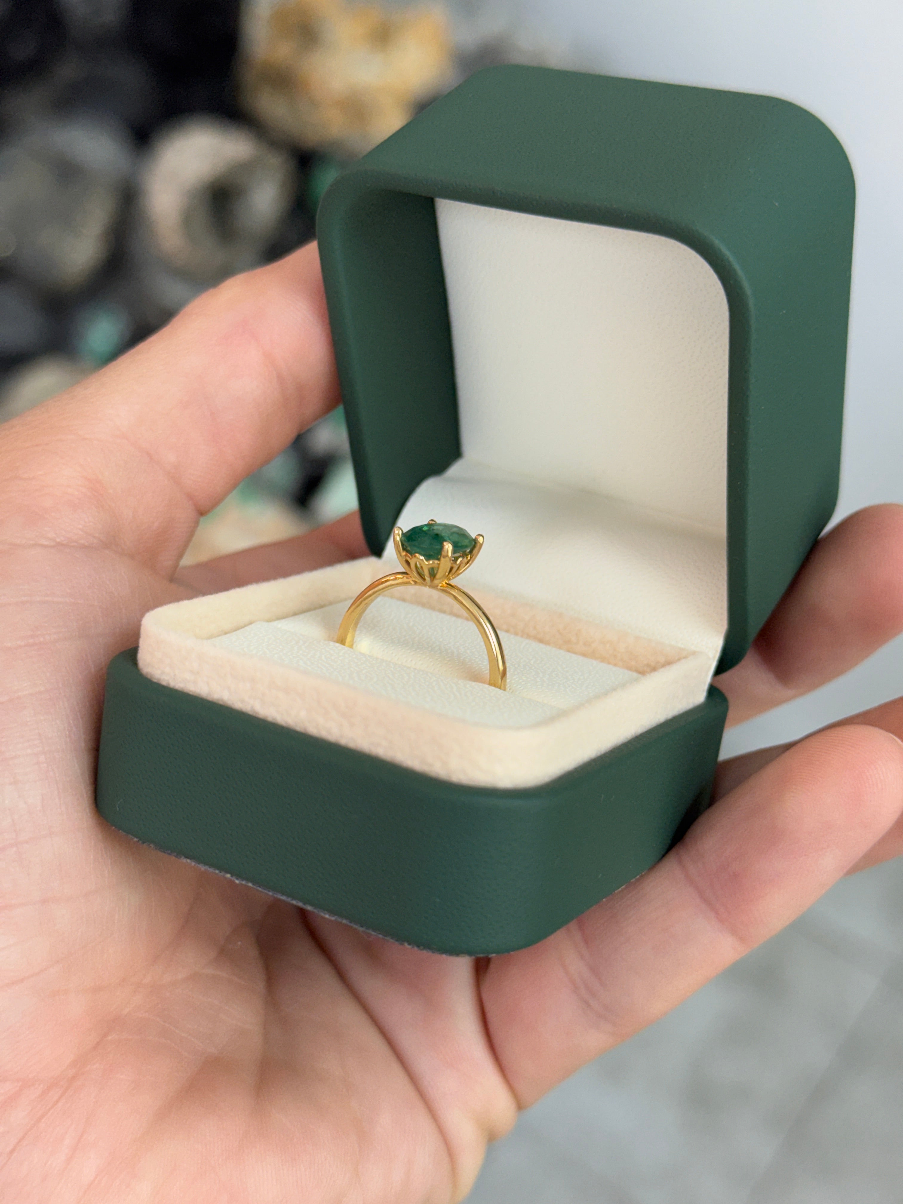 Natural 1.43 carat emerald oval cut solitaire engagement ring in 18K gold by JR Colombian Emeralds, featuring four prongs.