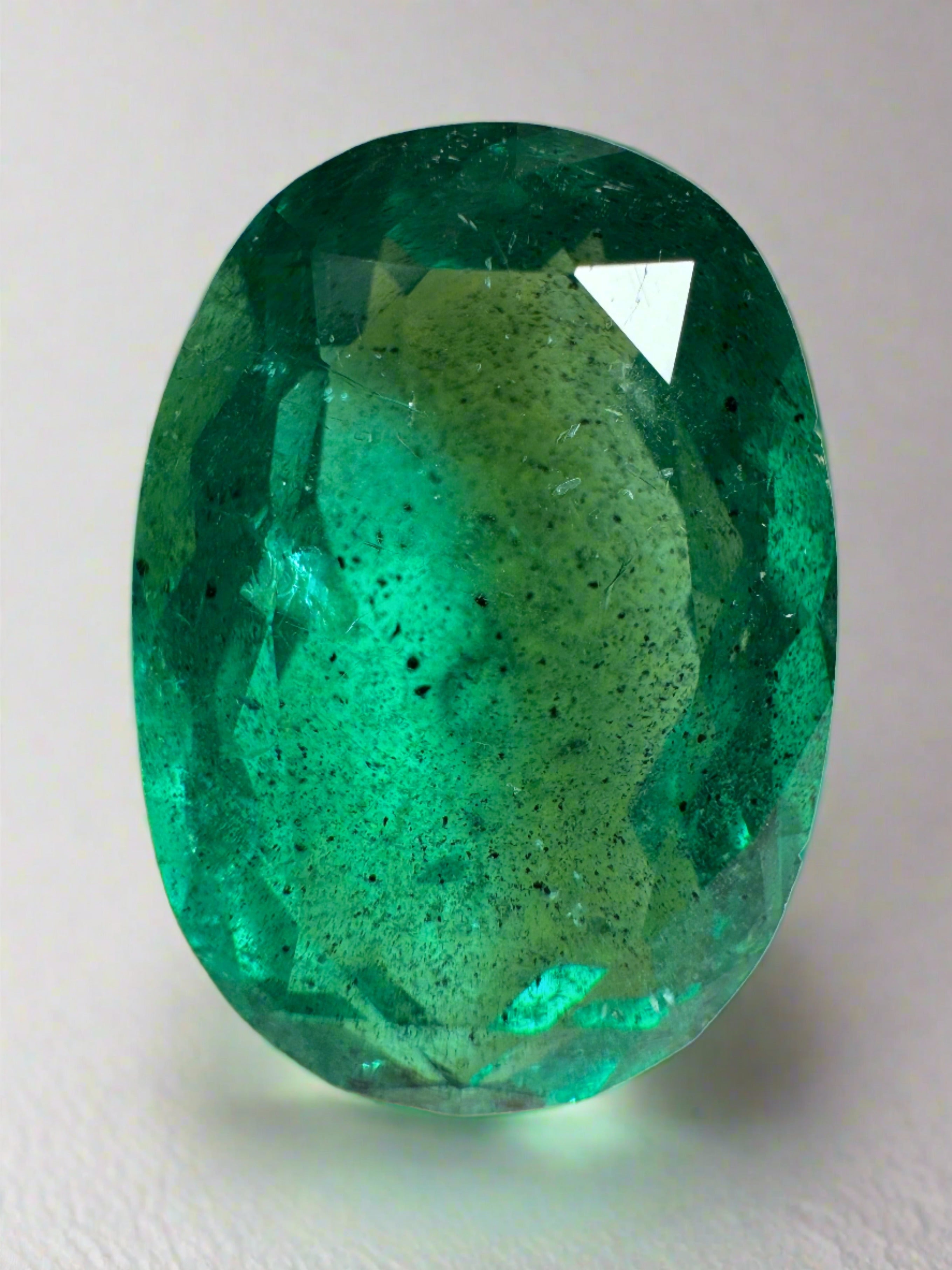 12.42 Carat 18x13 Freckled Rich Green Natural Loose Colombian Emerald-Oval Cut - JR Colombian Emeralds