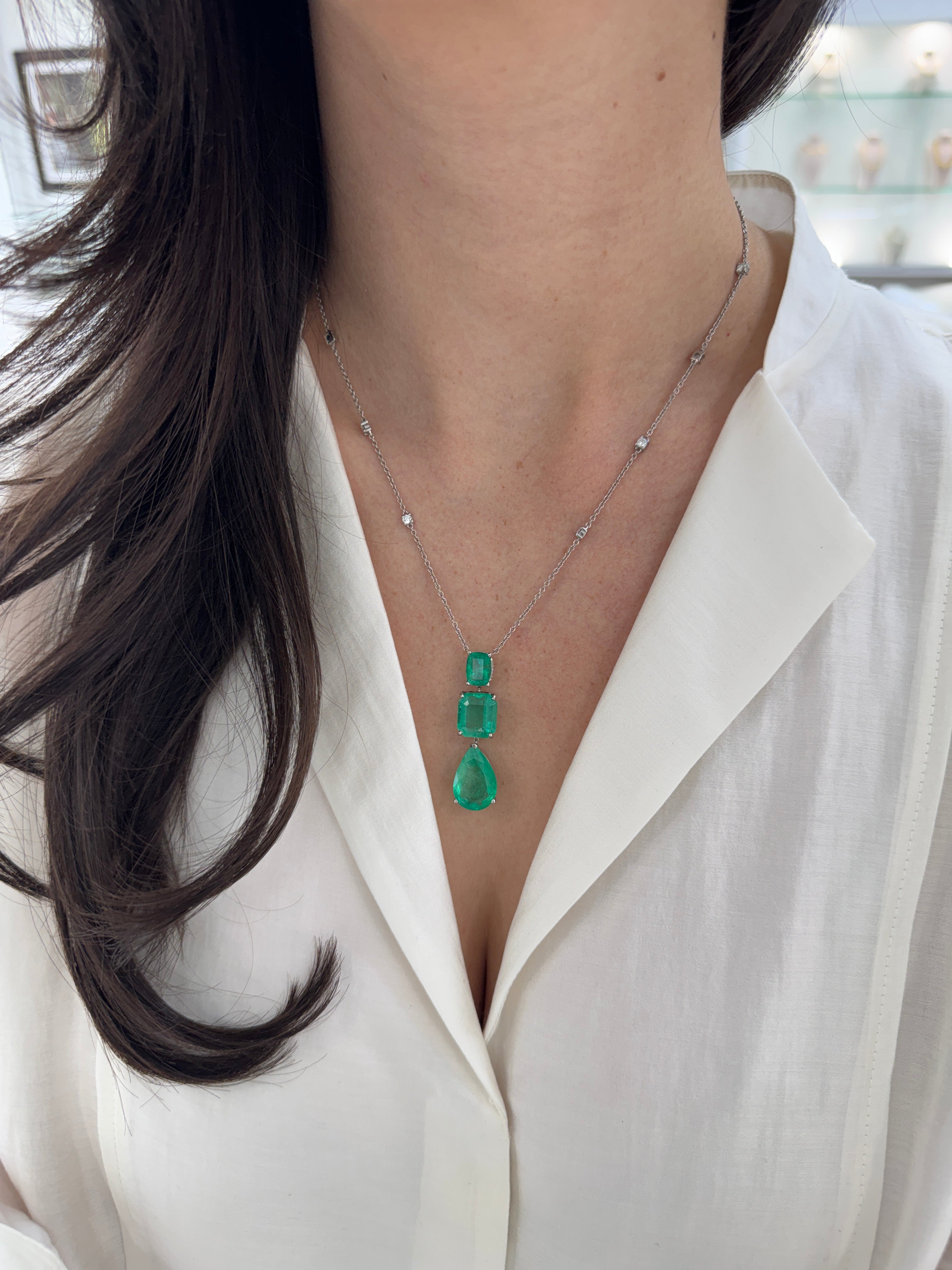 Colombian Emerald and diamond by the yard necklace with cushion and pear-shaped emerald cuts in platinum, featuring 21.29 tcw gemstones.