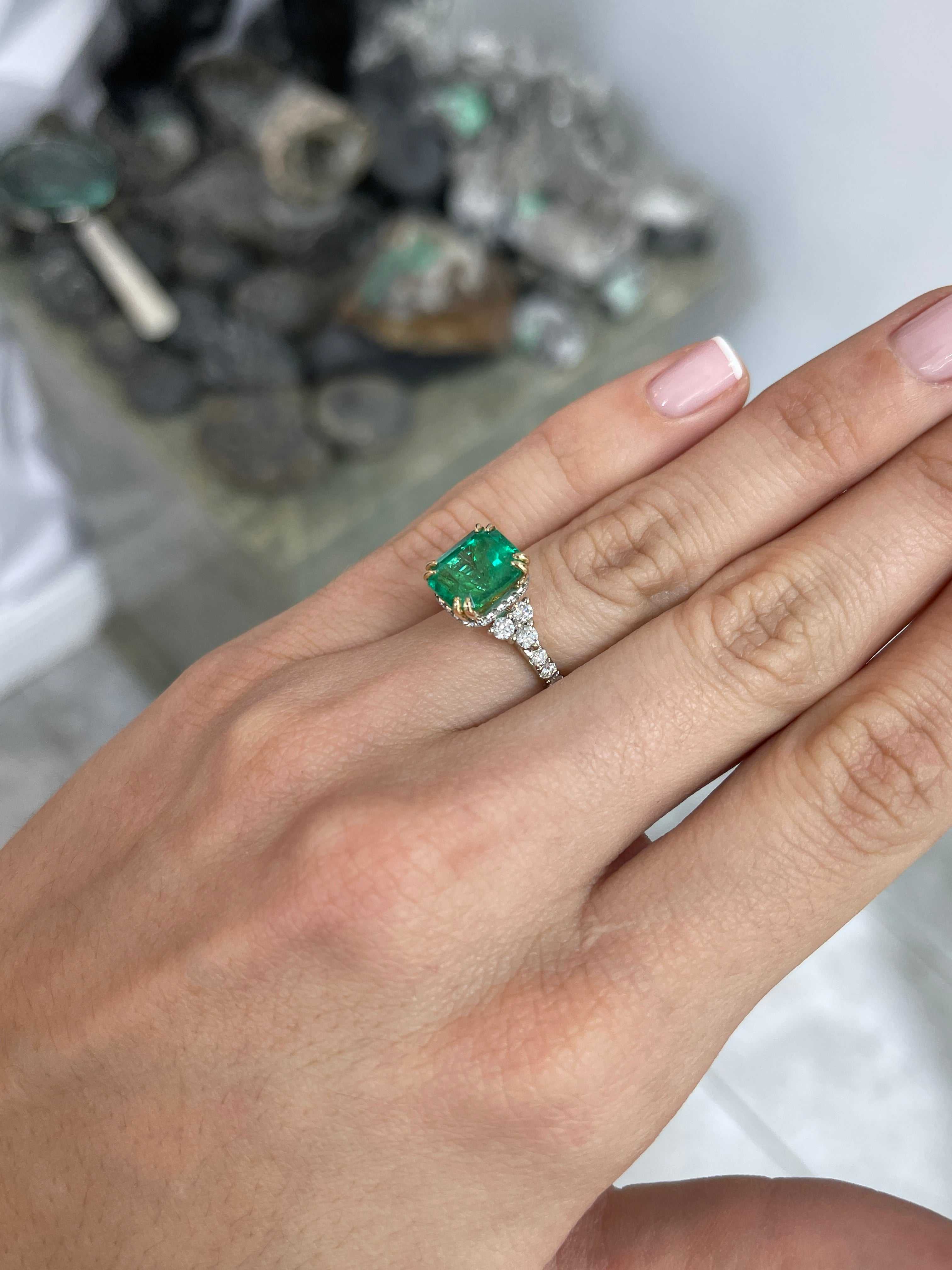 4.69tcw Emerald Cut Colombian Emerald 7 Stone with Hidden Diamond Halo & Shank 18K