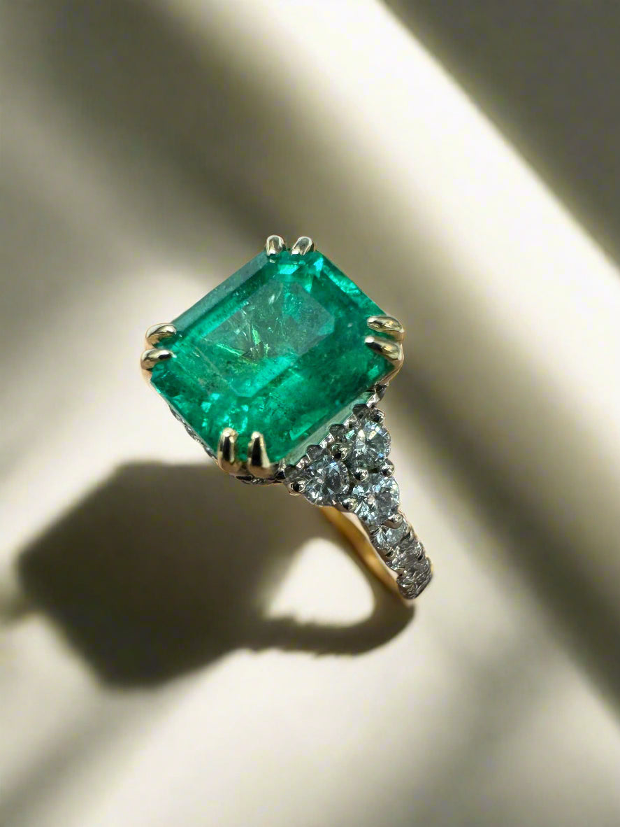 4.69tcw Emerald Cut Colombian Emerald 7 Stone with Hidden Diamond Halo & Shank 18K