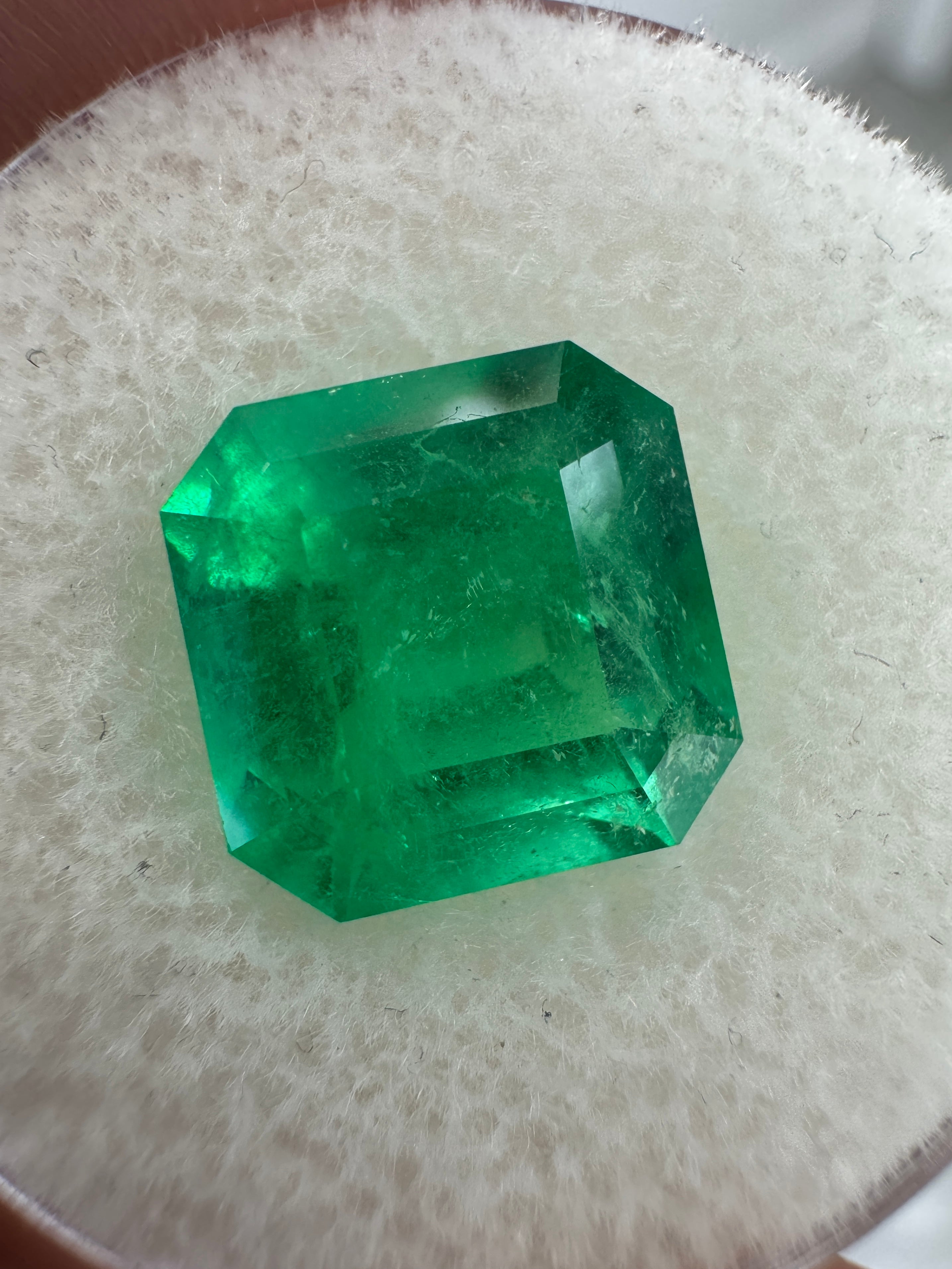 4.35 carat 10x10 mm Colombian emerald loose gemstone with Asscher cut and glowing Kryptonite green color, by JR Colombian Emeralds.