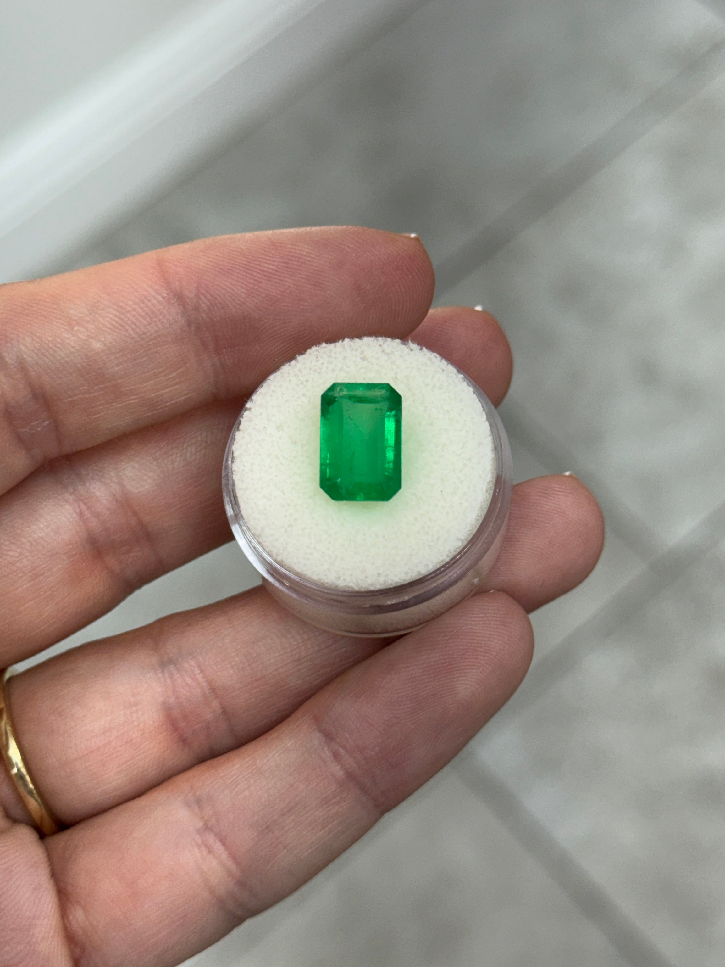 4.68 carat 12x8mm natural Colombian emerald loose gemstone in emerald cut, vivid green color from JR Colombian Emeralds.