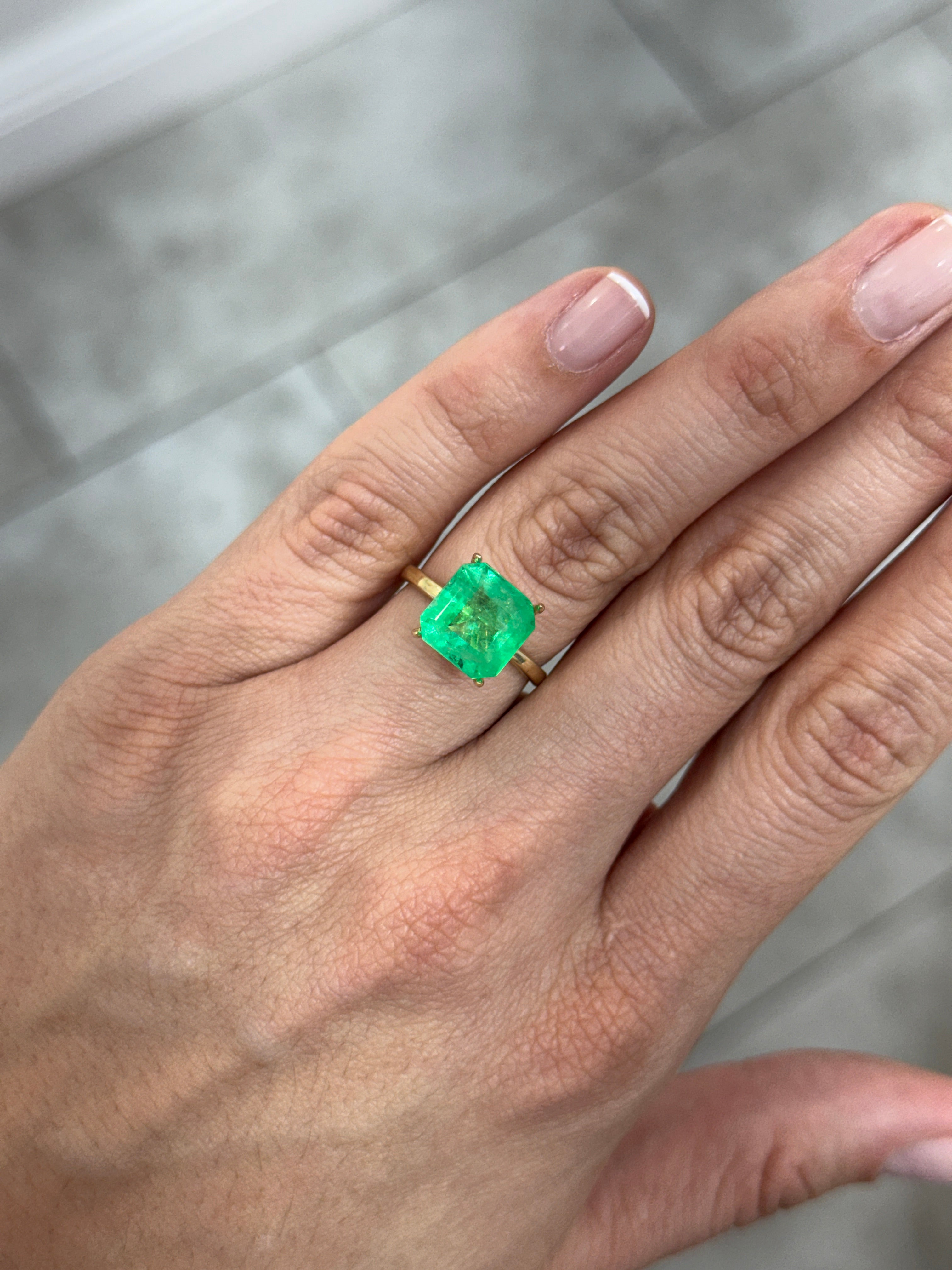 Yellowish green Colombian emerald Asscher cut with clipped corners, 4.88 carats, from JR Colombian Emeralds.