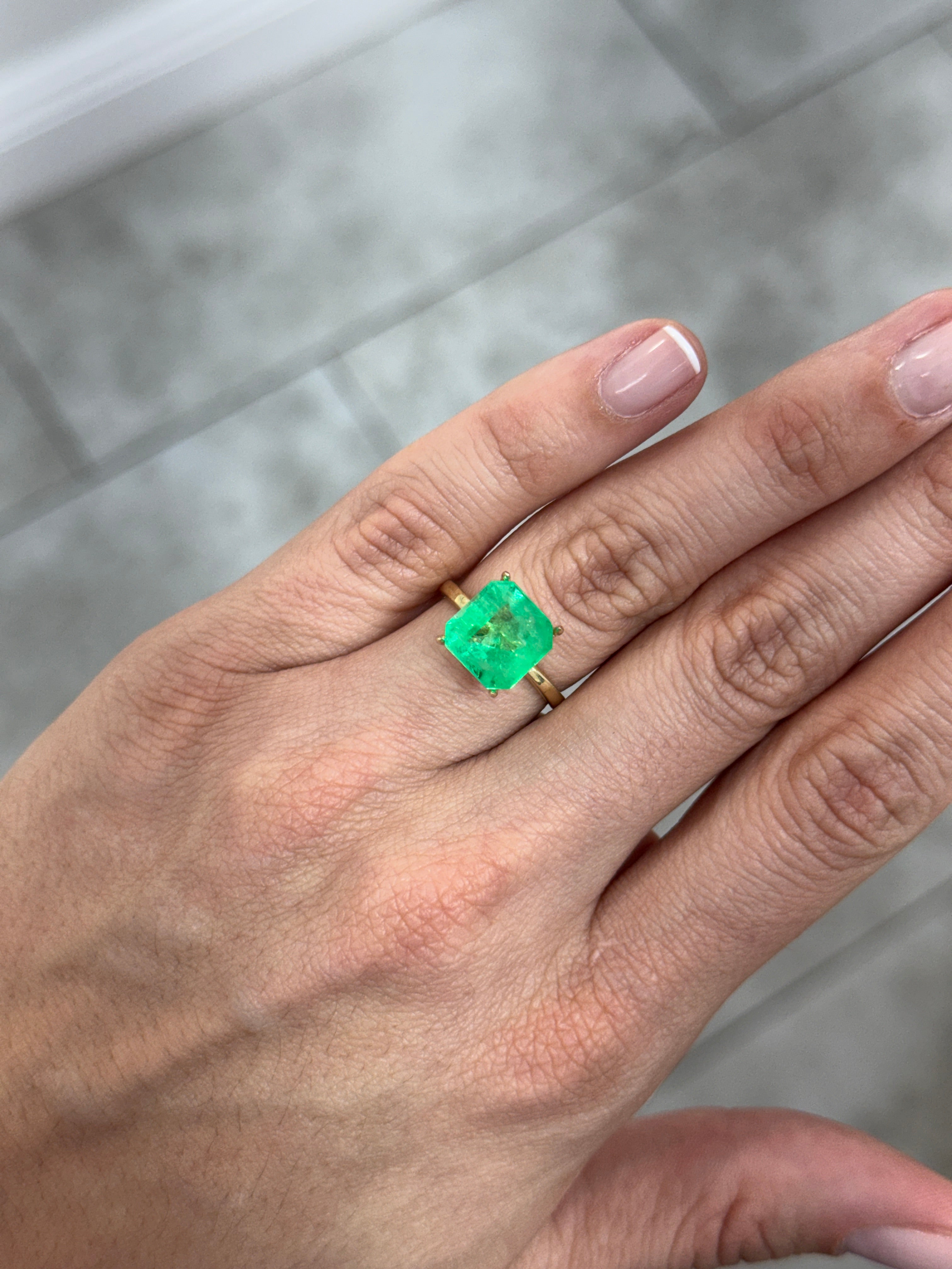 Yellowish green Colombian emerald Asscher cut with clipped corners, 4.88 carats, from JR Colombian Emeralds.