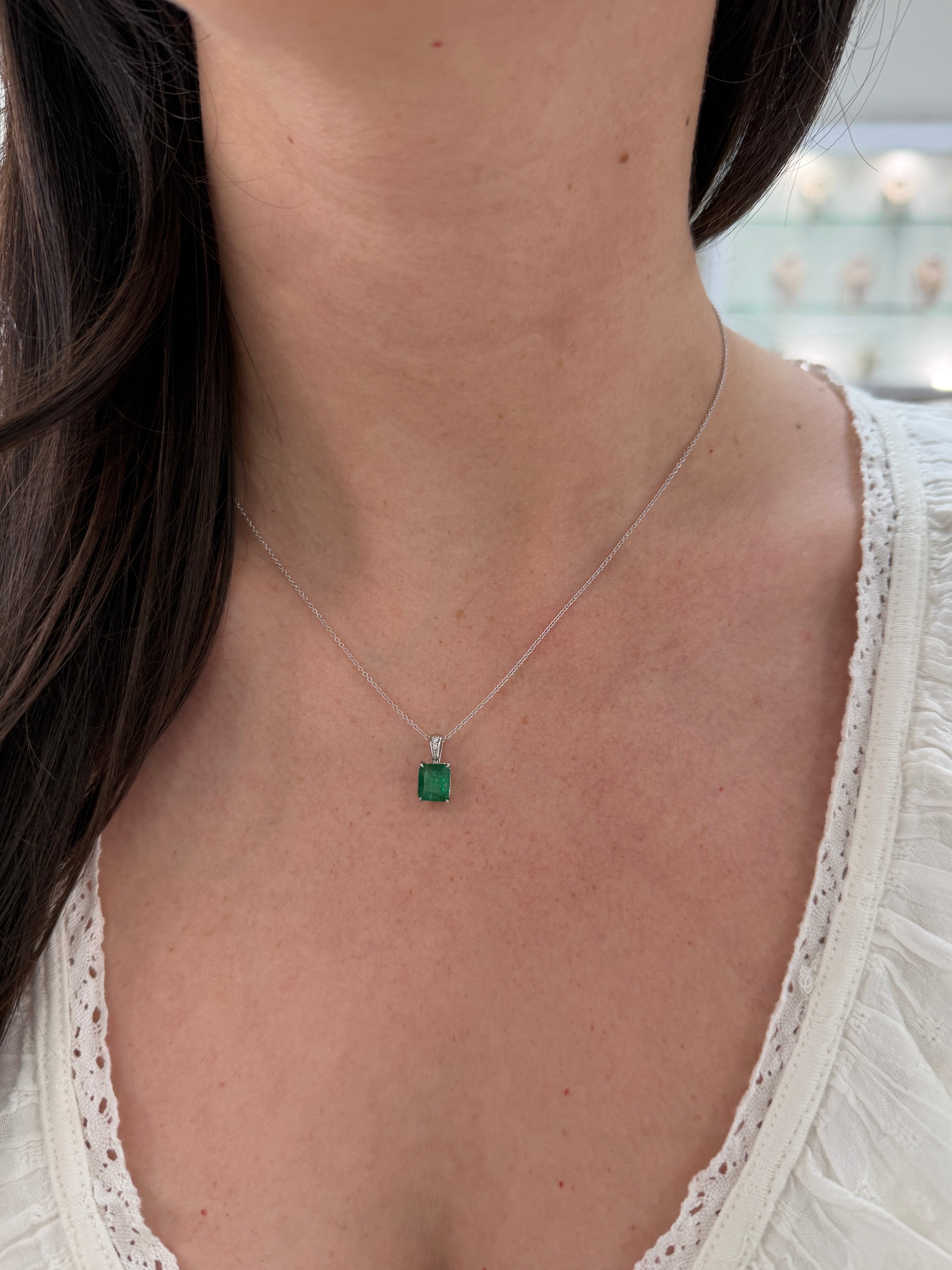 Emerald cut emerald and diamond bail pendant in 14K white gold with 1.60tcw, featuring a vibrant green emerald by JR Colombian Emeralds