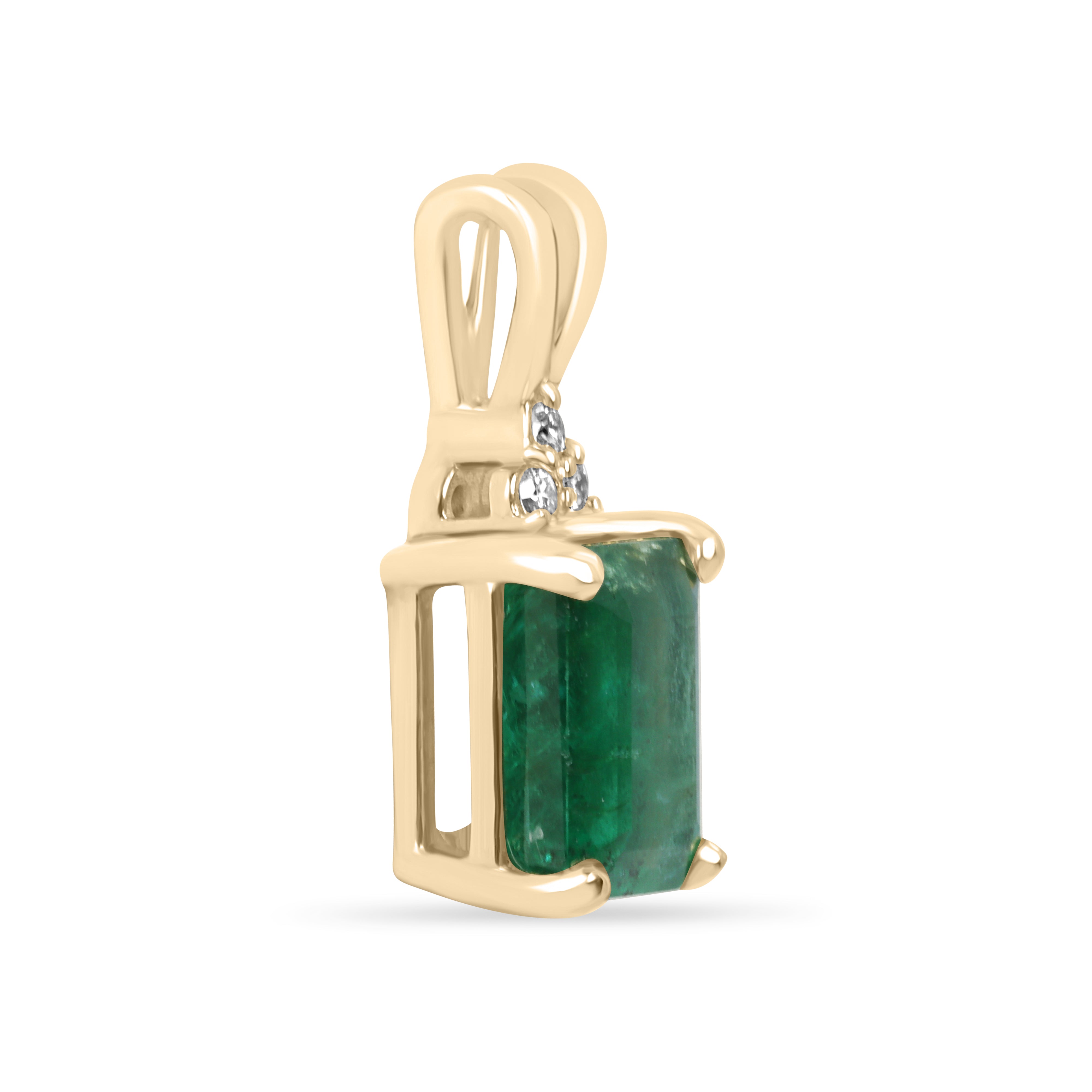 Emerald cut emerald pendant with trefoil diamond accents in 14K gold, showcasing a luxurious green gemstone and intricate design.