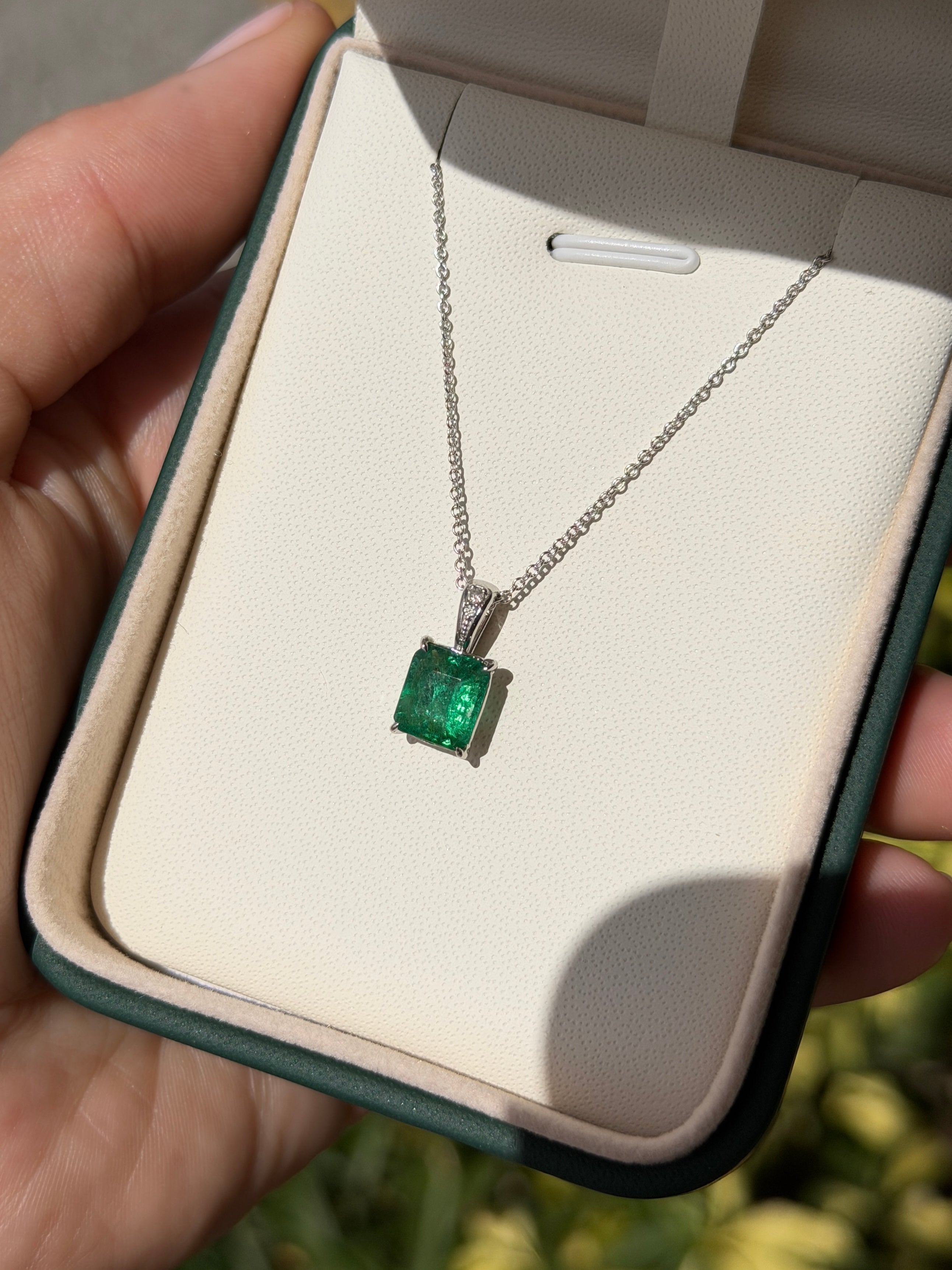 Emerald cut emerald and diamond bail pendant in 14K white gold, featuring a 1.60tcw gemstone from JR Colombian Emeralds.