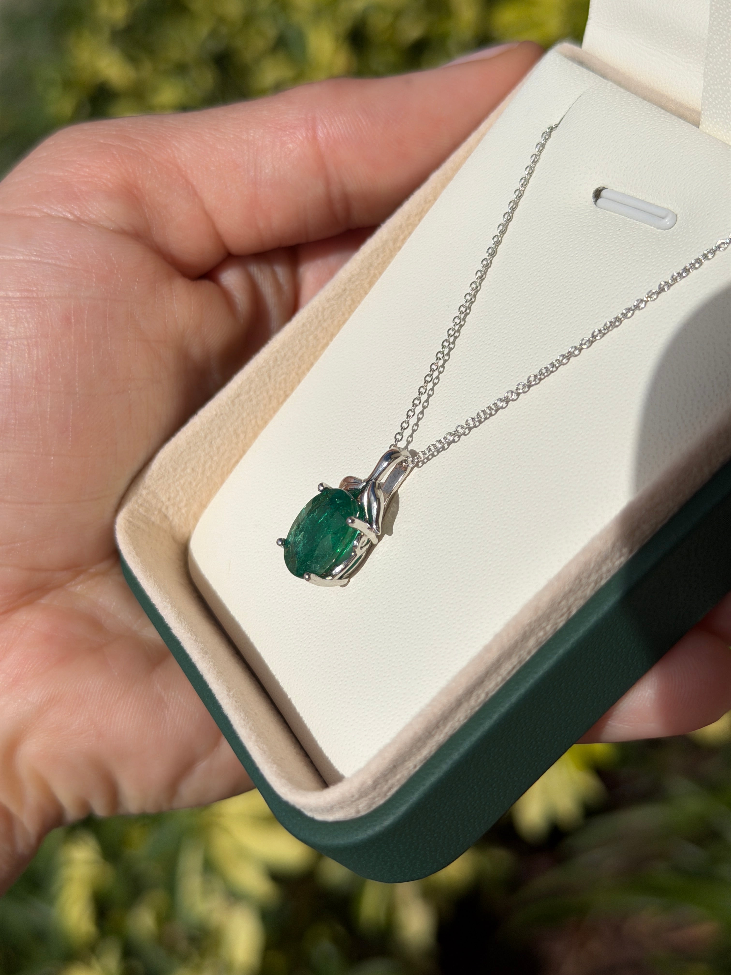 3.23 carat oval cut emerald pendant with leaf bail, platinum necklace, natural inspired design by JR Colombian Emeralds
