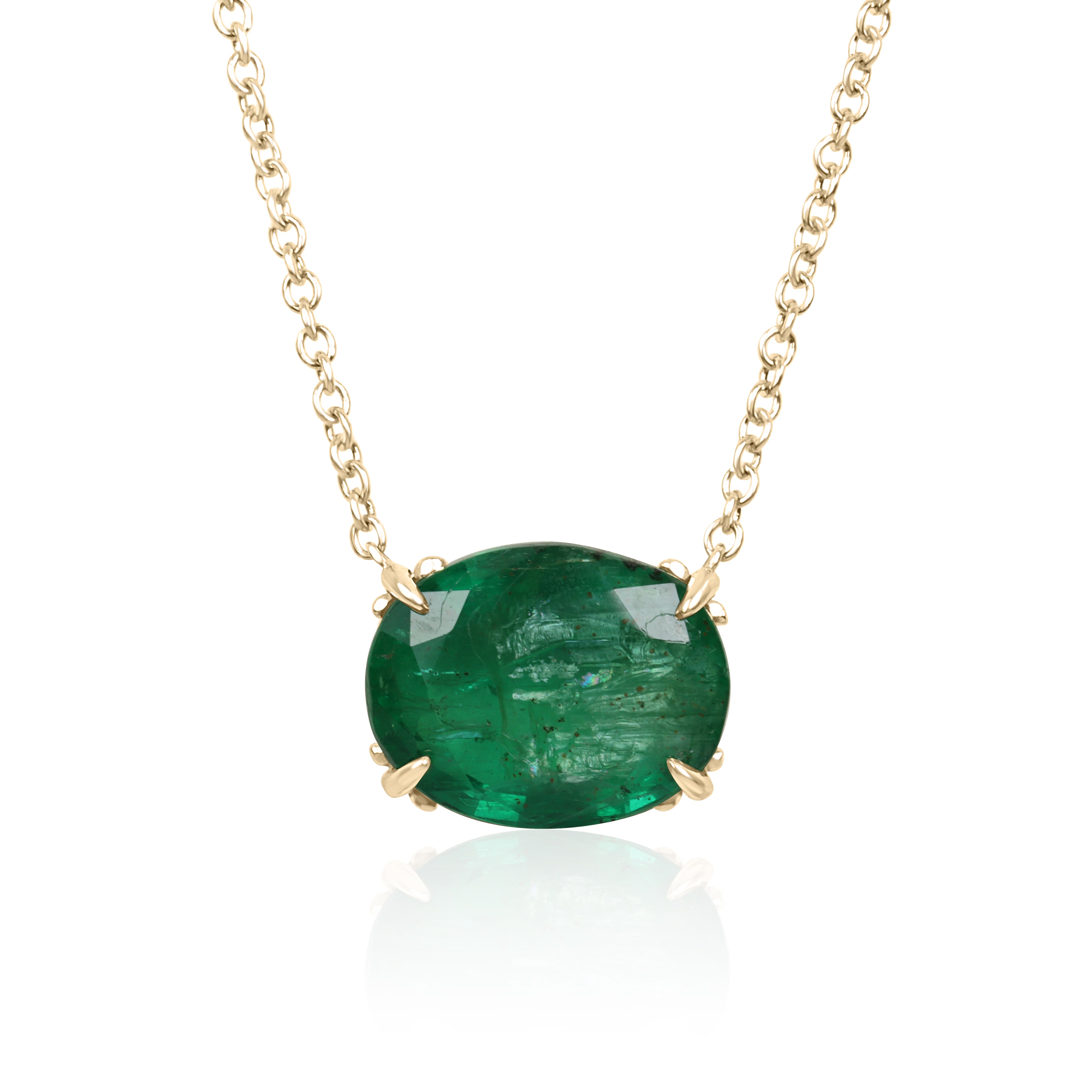 18K gold necklace featuring a 6.80ct oval natural emerald floral pendant with Fleur De Lis design, by JR Colombian Emeralds.