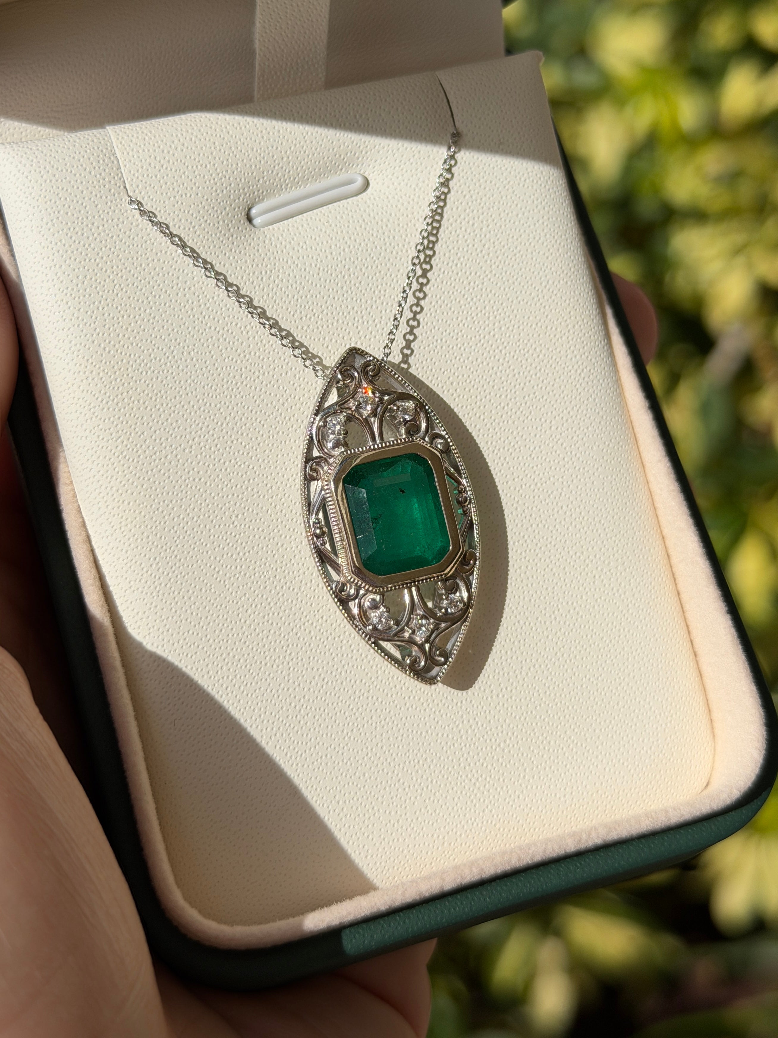 Art Deco-inspired emerald cut emerald and diamond slider necklace in 14K gold by JR Colombian Emeralds.