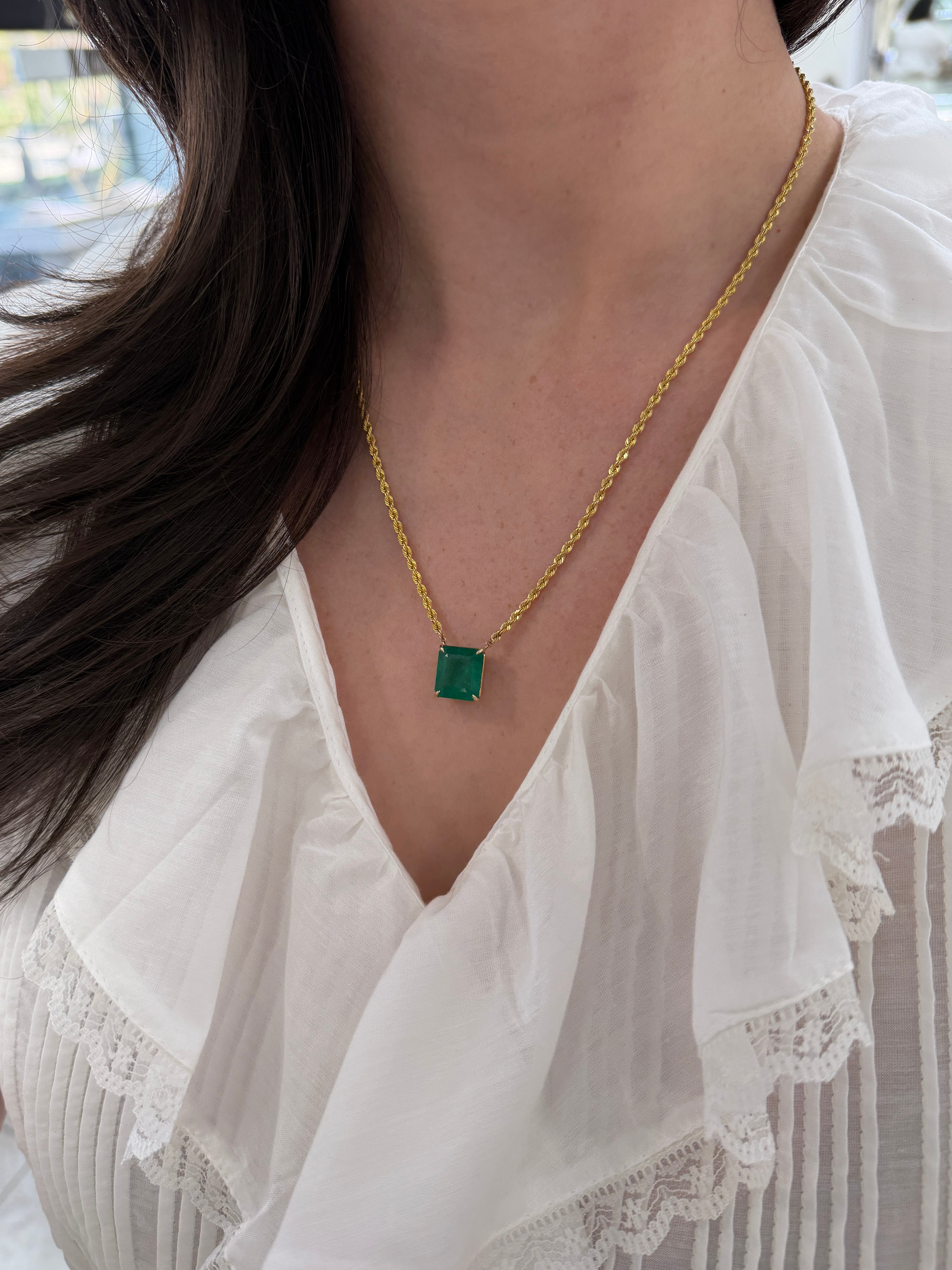 Emerald cut 10.38ct emerald solitaire on a 20-inch 14K gold rope chain, jewelry by JR Colombian Emeralds.