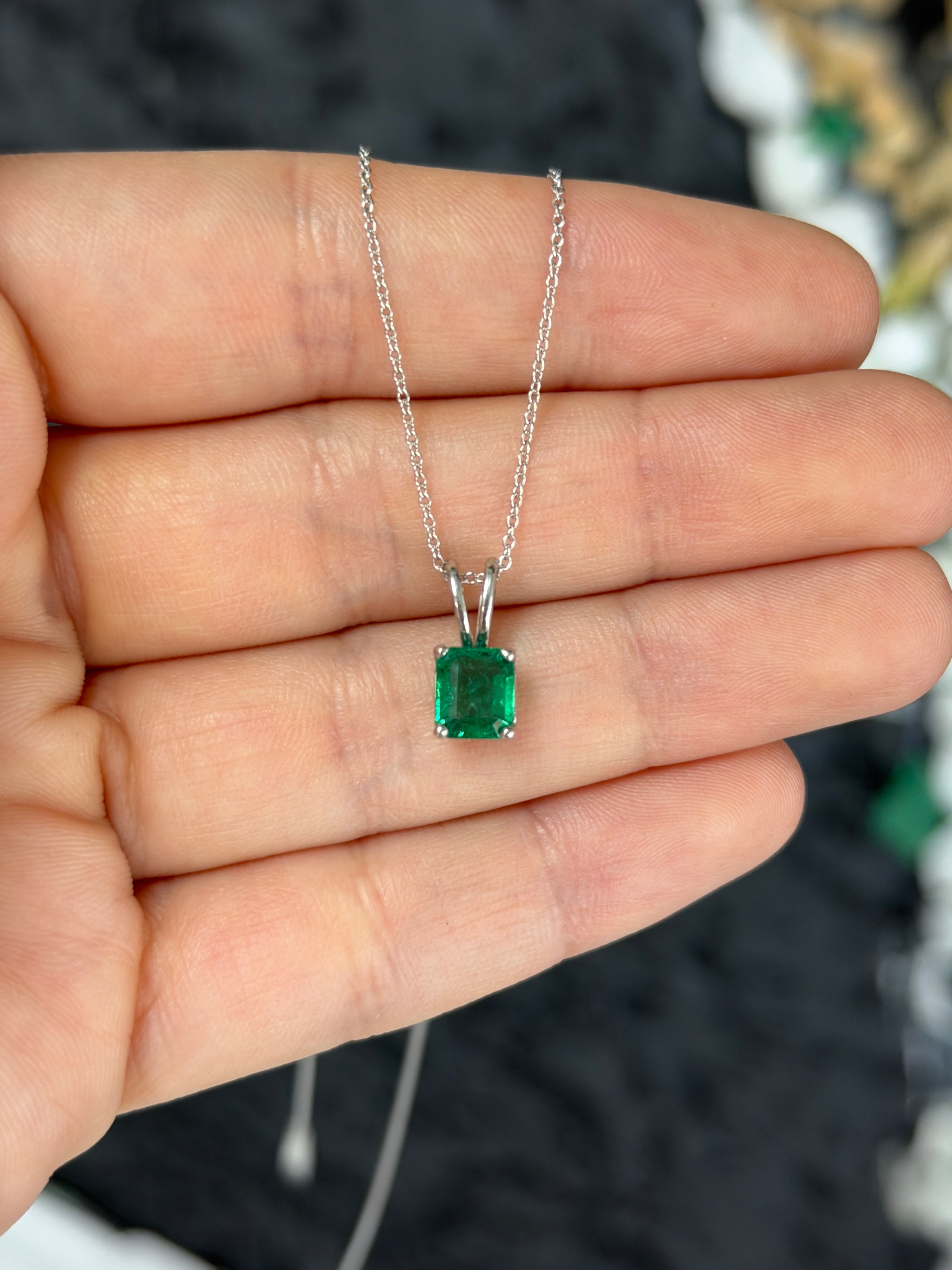 2.10ct platinum emerald solitaire necklace featuring a rich green Asscher cut emerald, jewelry by JR Colombian Emeralds.