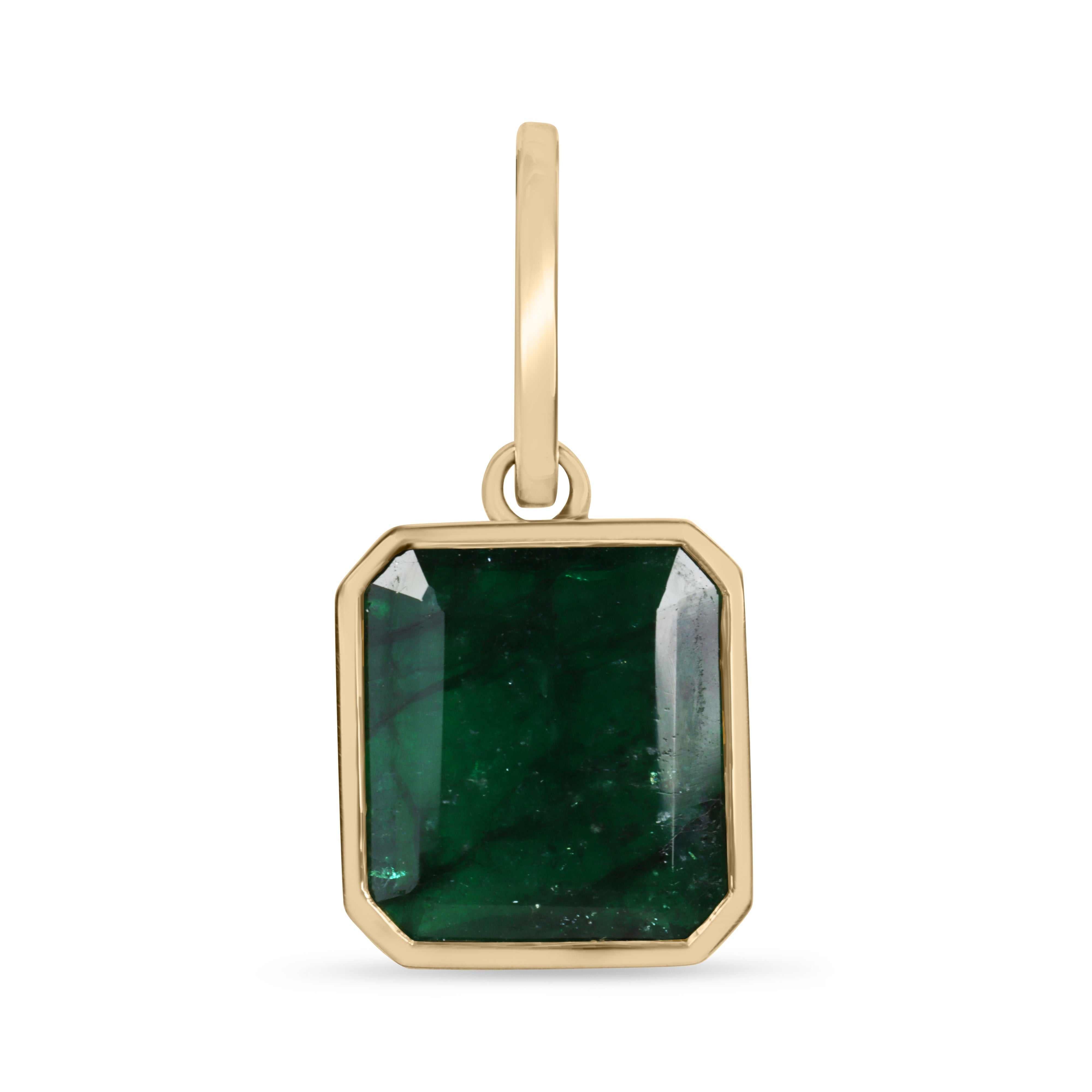 7.79 carat dark green Zambian emerald necklace with bezel setting in 14K gold, featuring a stunning rich green gemstone.