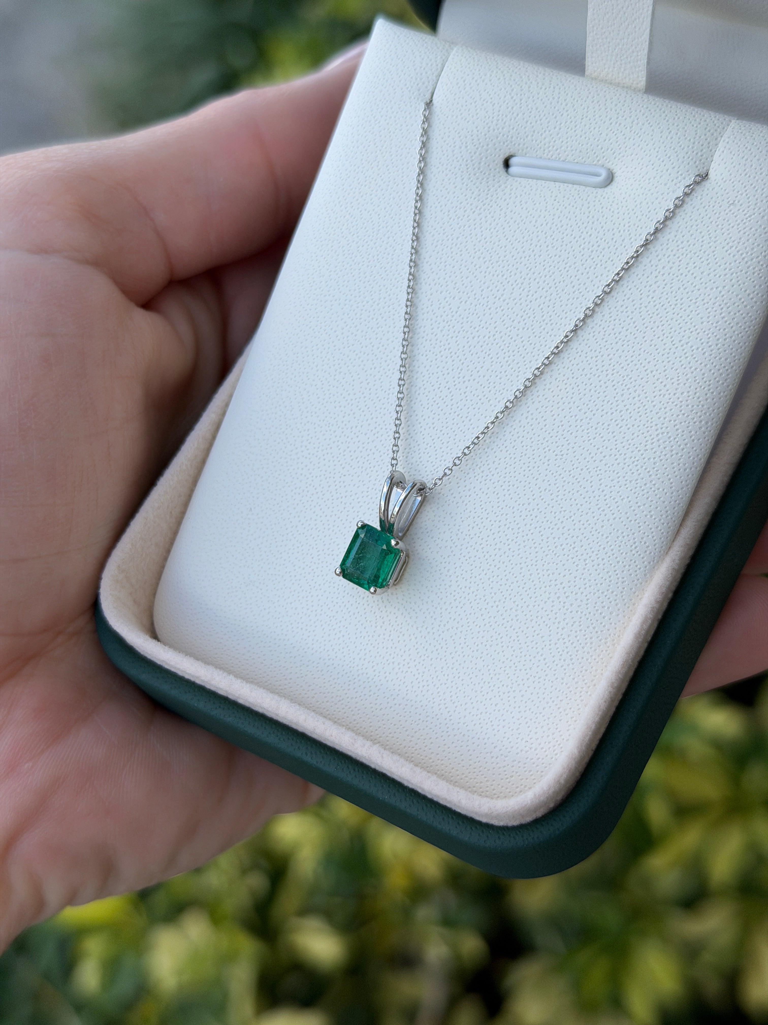 2.10ct platinum emerald solitaire necklace featuring a rich green Asscher cut emerald from JR Colombian Emeralds.