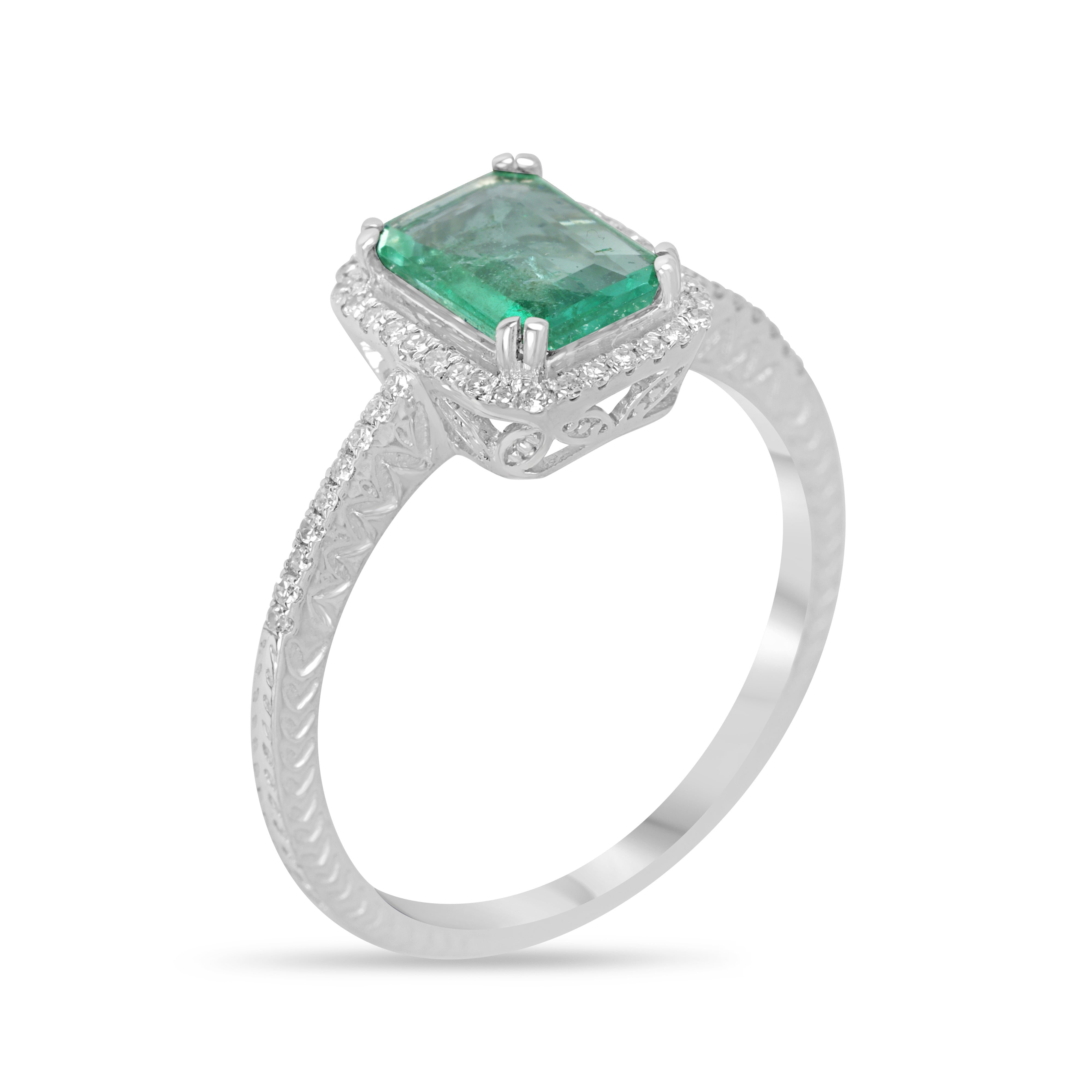 10x7.5mm emerald and diamond halo engagement ring in 14K white gold by JR Colombian Emeralds, featuring a clear crystal appearance.