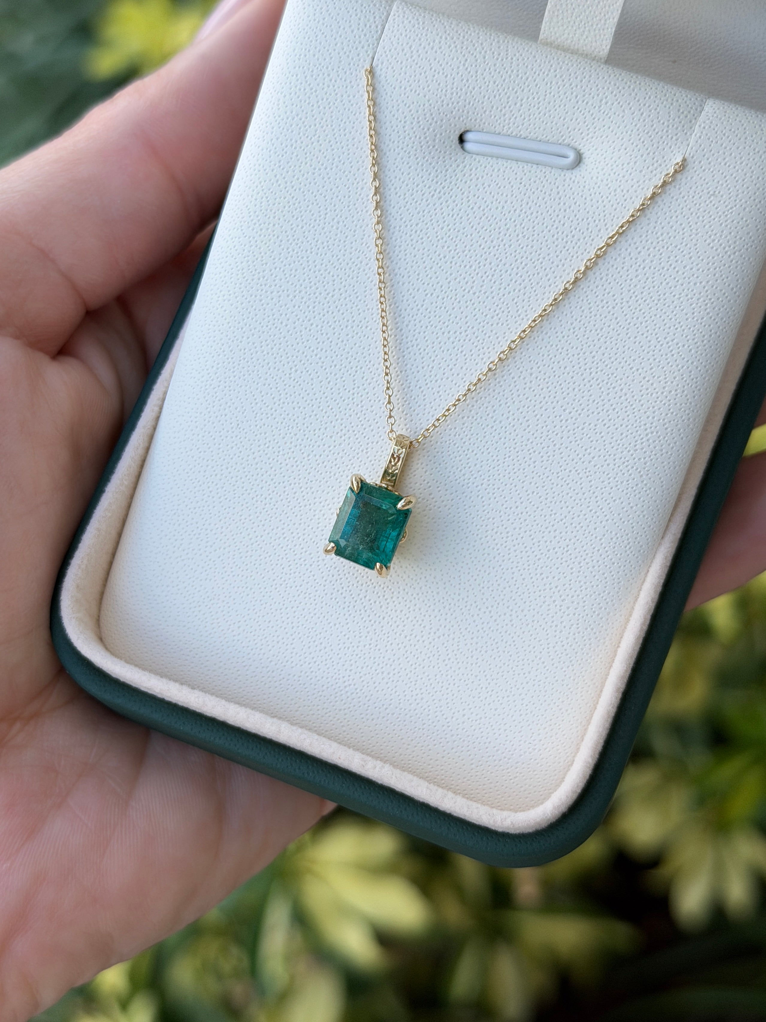 14K gold solitaire emerald necklace featuring a 3.50 carat fleur de lis design by JR Colombian Emeralds.