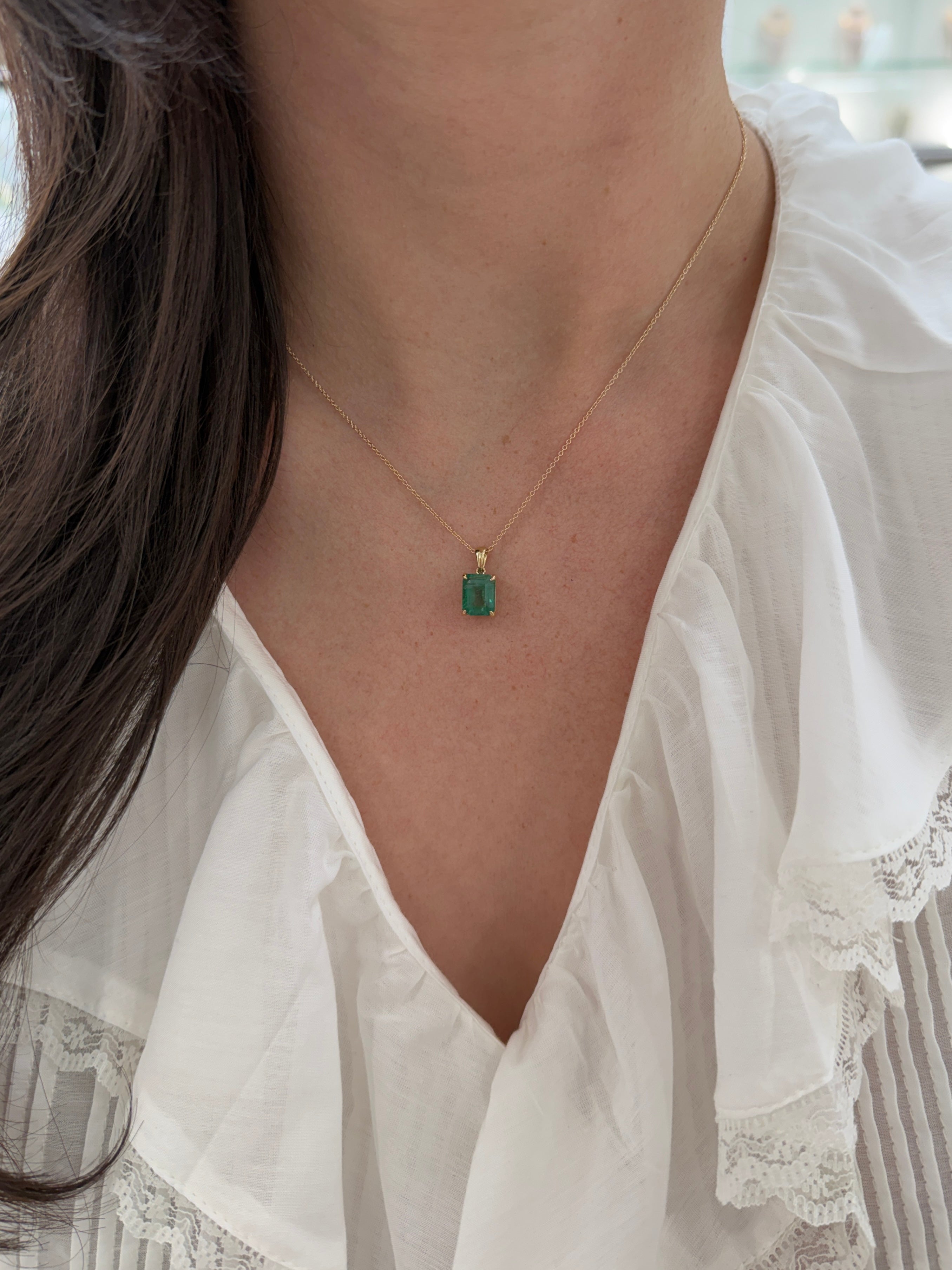 14K gold emerald solitaire necklace featuring a 4.25ct earthy natural emerald from JR Colombian Emeralds.