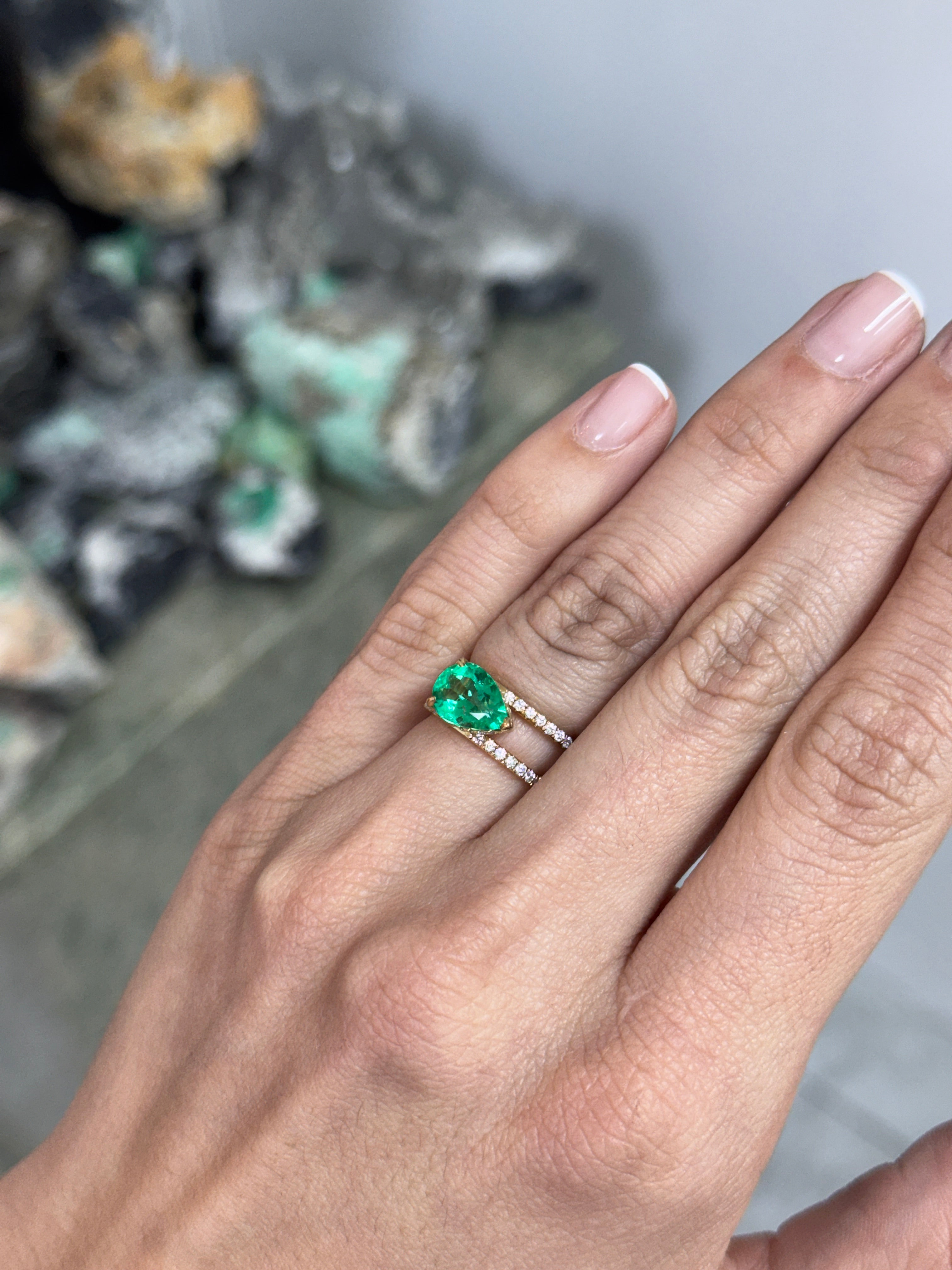 East to West Colombian Emerald and diamond wide band ring in 18K gold, featuring a split shank design by JR Colombian Emeralds.