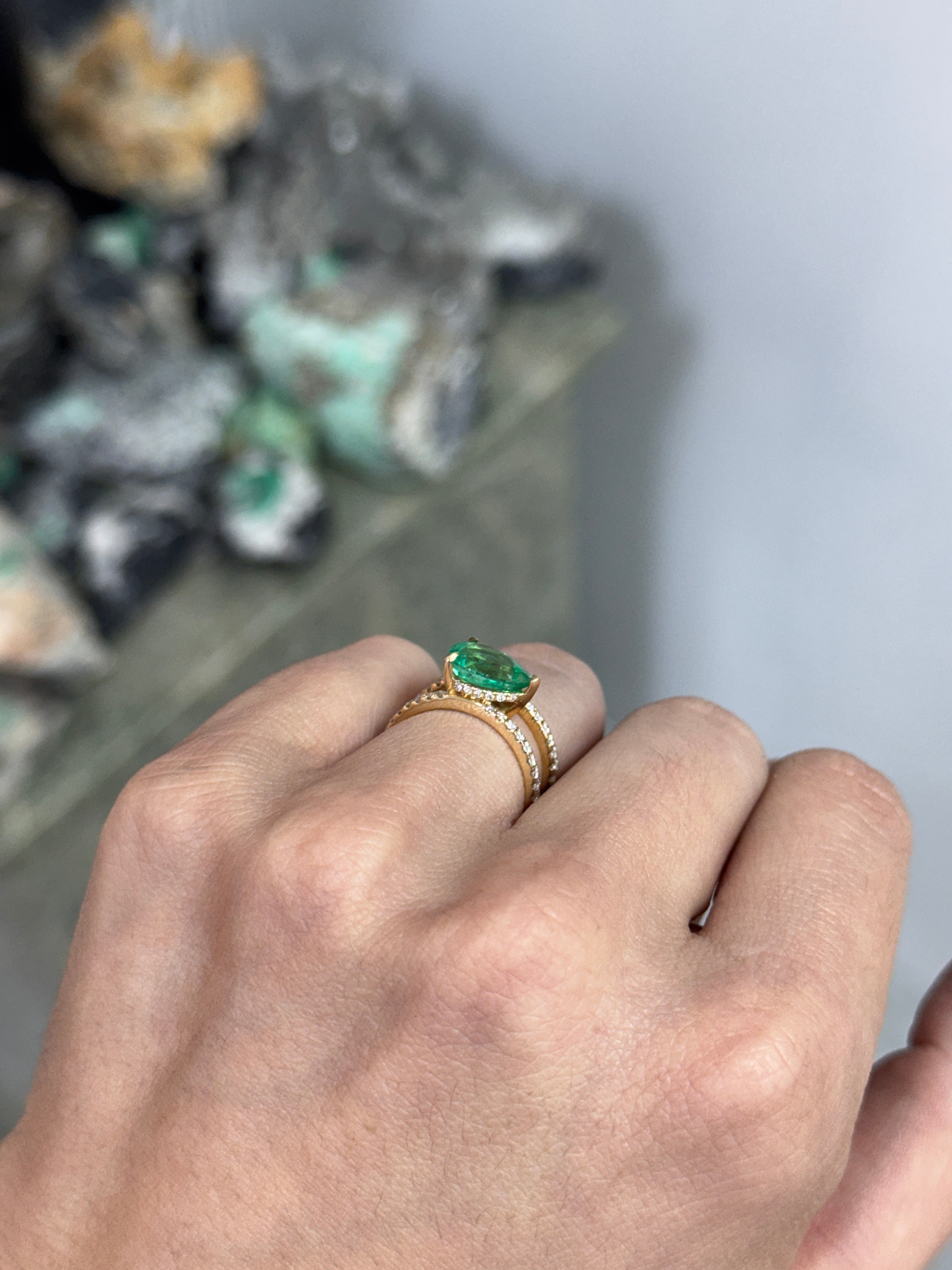 East to West Colombian Emerald and diamond wide band ring in 18K gold, featuring split shank design by JR Colombian Emeralds.