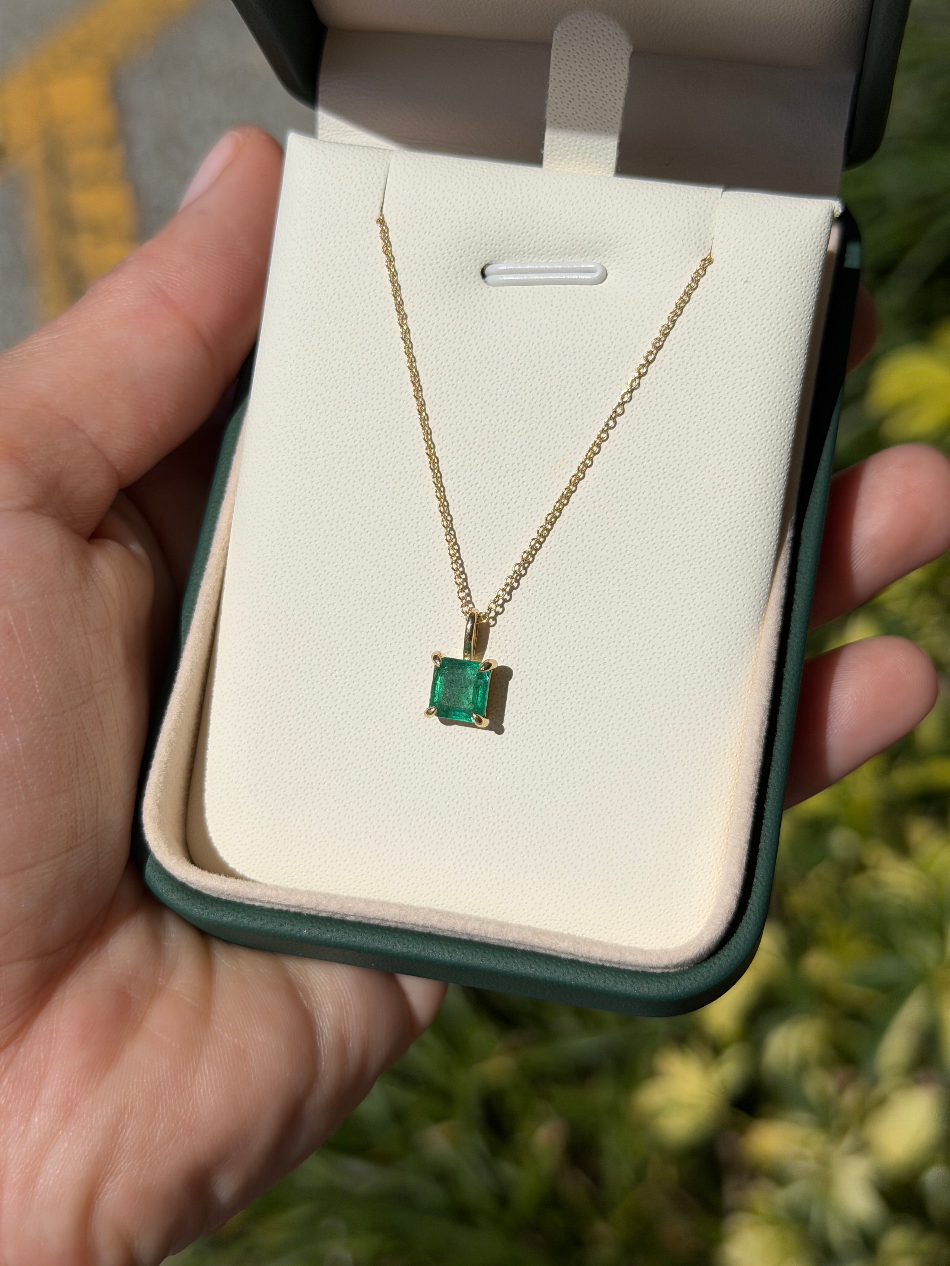 Petite 1.35 Carat Asscher Emerald Solitaire Necklace in 14K gold by JR Colombian Emeralds, showcasing a sparkling green gemstone.