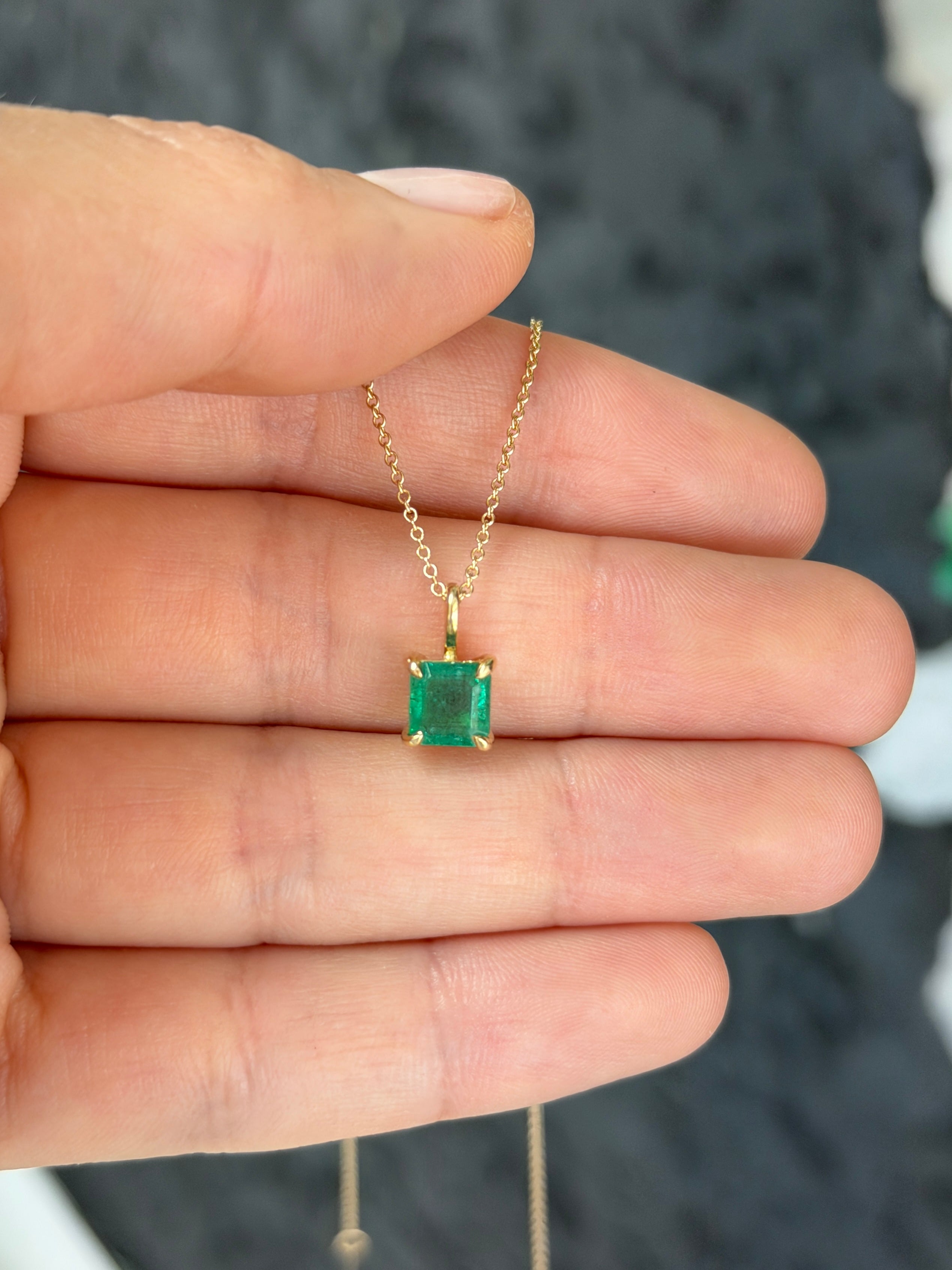 Petite 1.35 Carat Asscher Emerald Solitaire Necklace in 14K gold by JR Colombian Emeralds, showcasing the emerald centerpiece.