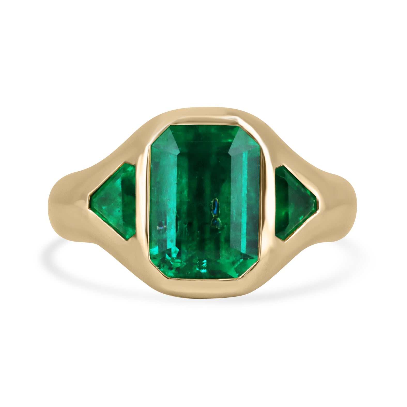 4.06tcw 18K yellow gold Muzo Colombian emerald three-stone trilogy ring with bezel-set emerald and trillion cut stones