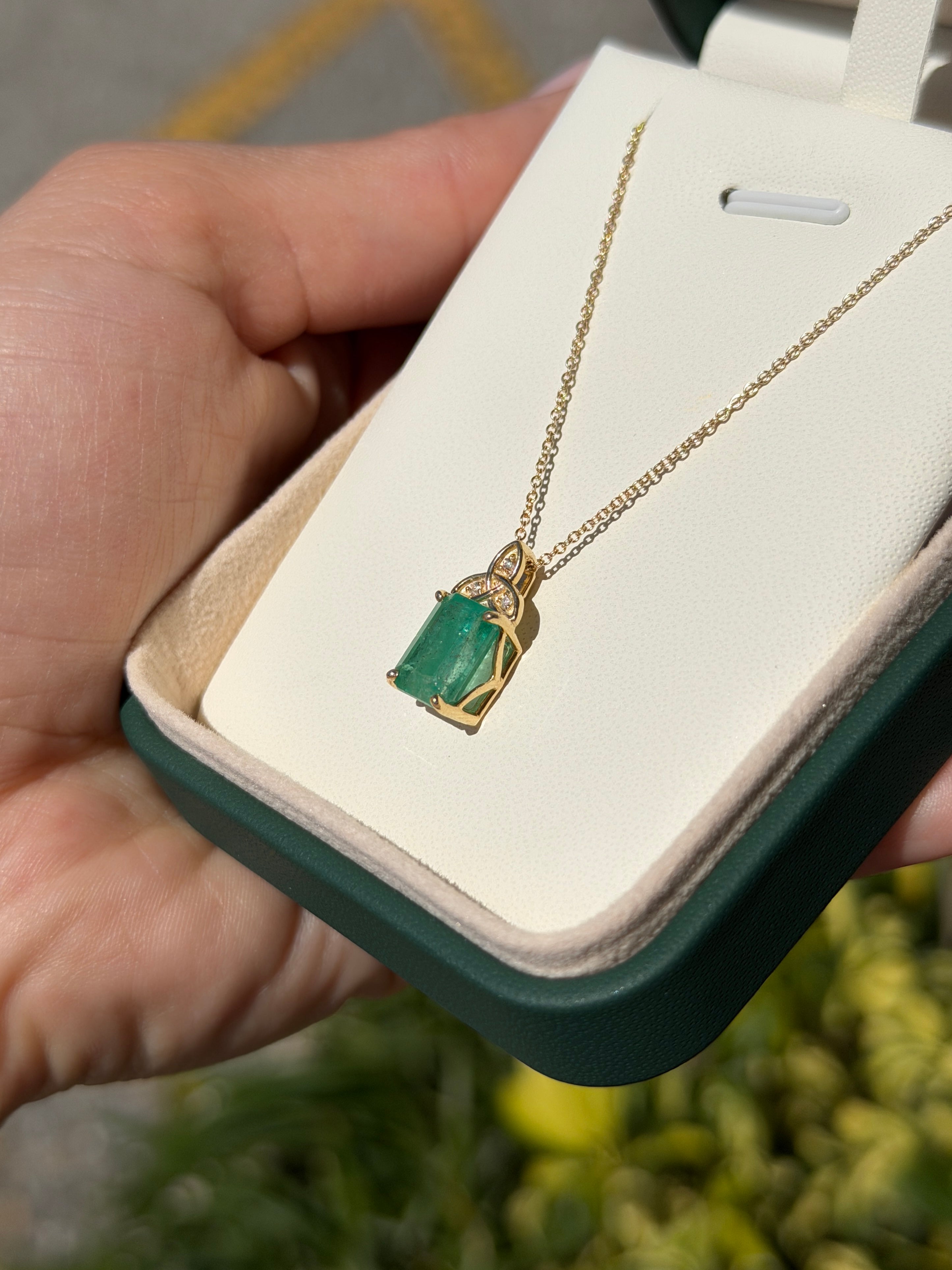 14K yellow gold Trinity knot emerald solitaire necklace with a 2.12tcw emerald center stone by JR Colombian Emeralds.