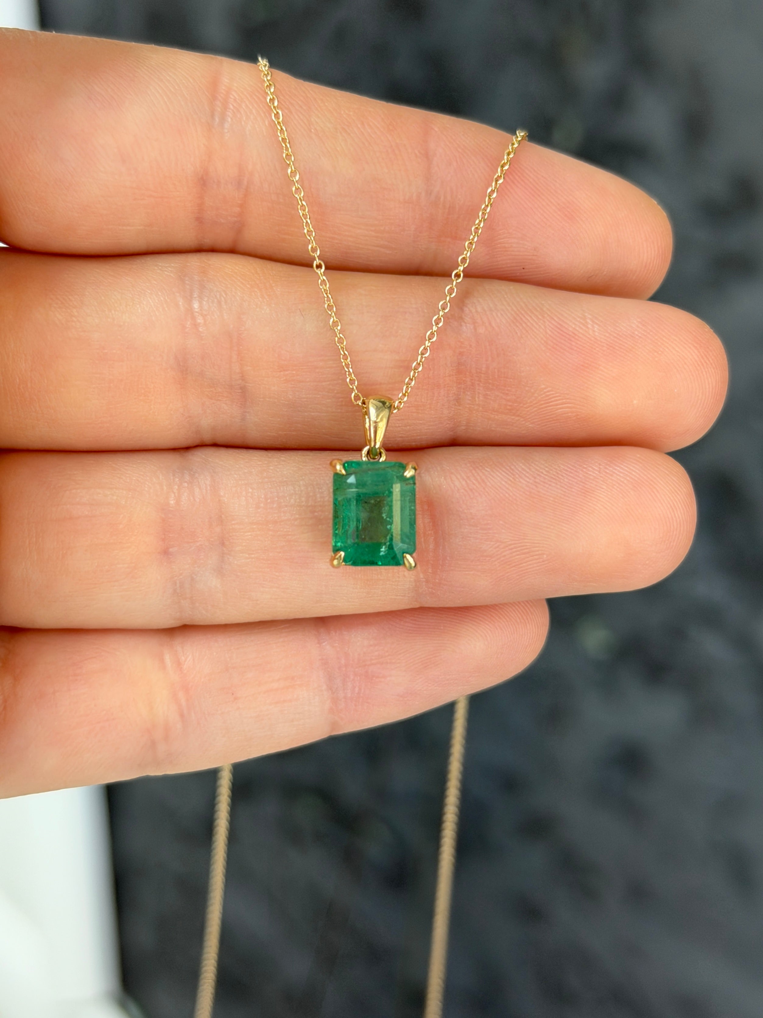 14K gold natural emerald solitaire necklace featuring a 4.25ct earthy Colombian emerald gemstone, elegant jewelry for women.
