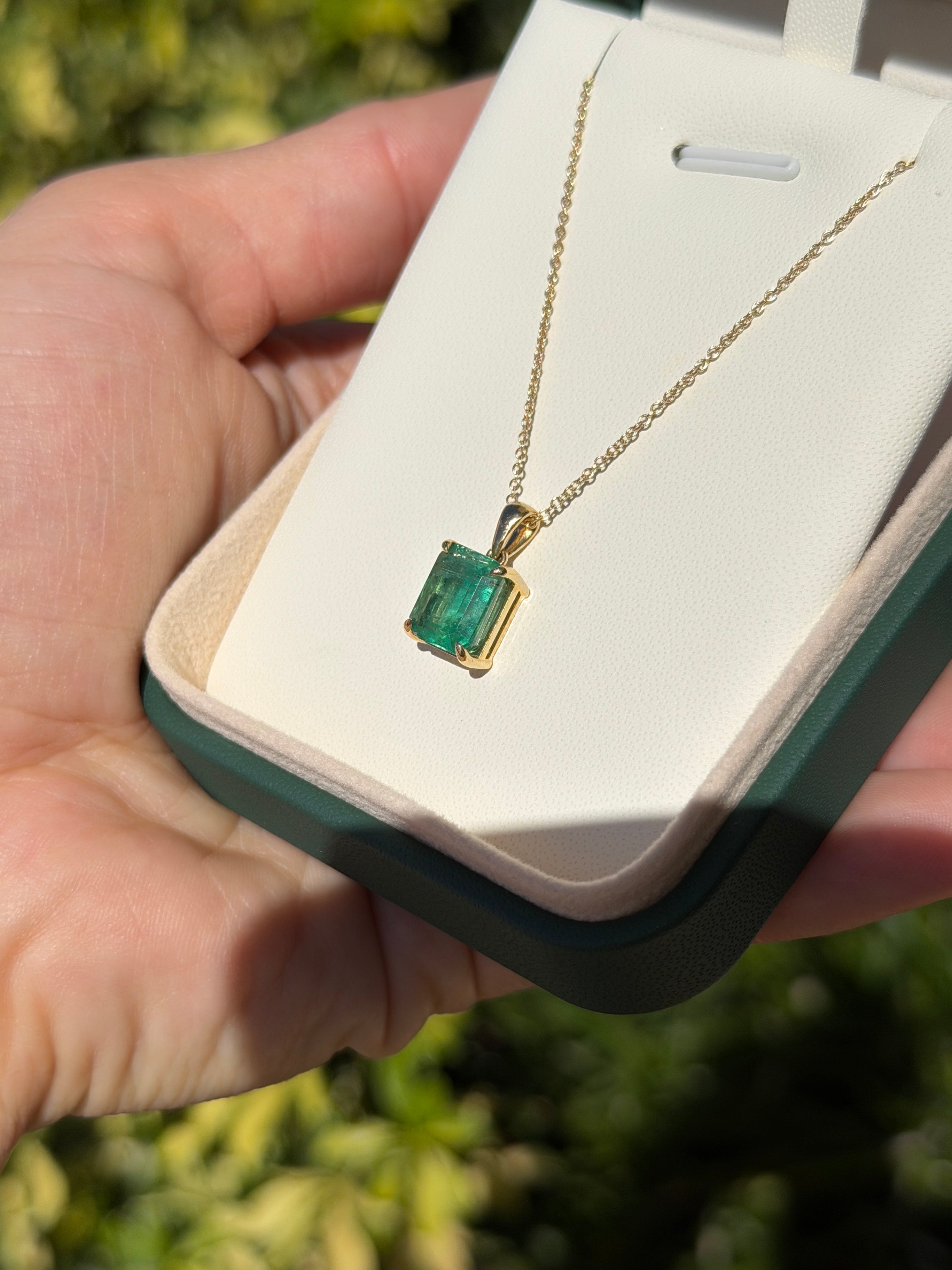 14K gold emerald solitaire necklace featuring a 4.25ct earthy natural emerald gemstone by JR Colombian Emeralds.