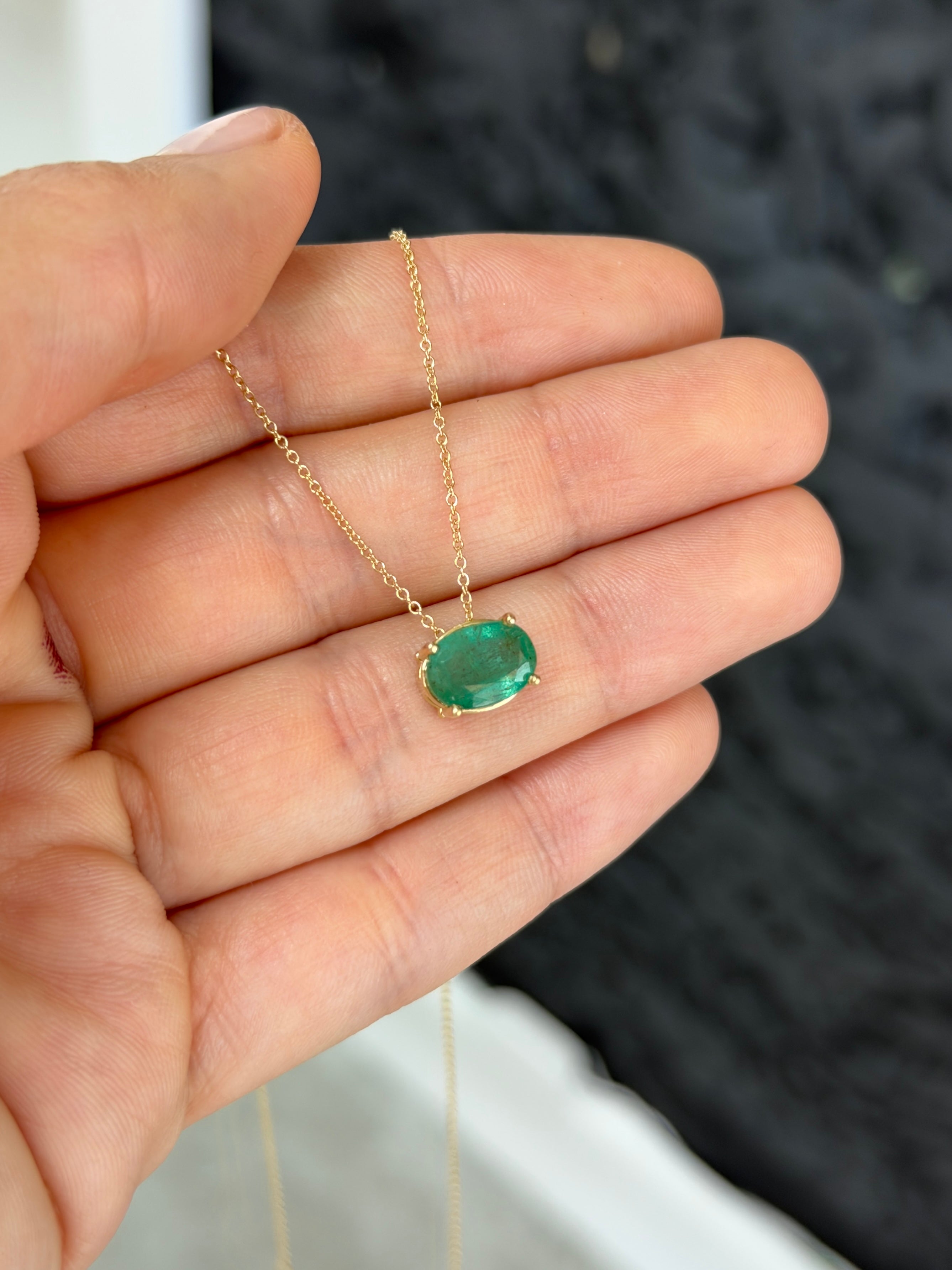 2.15 carat solitaire emerald oval slider necklace in 14K gold by JR Colombian Emeralds, featuring a vibrant green emerald centerpiece.