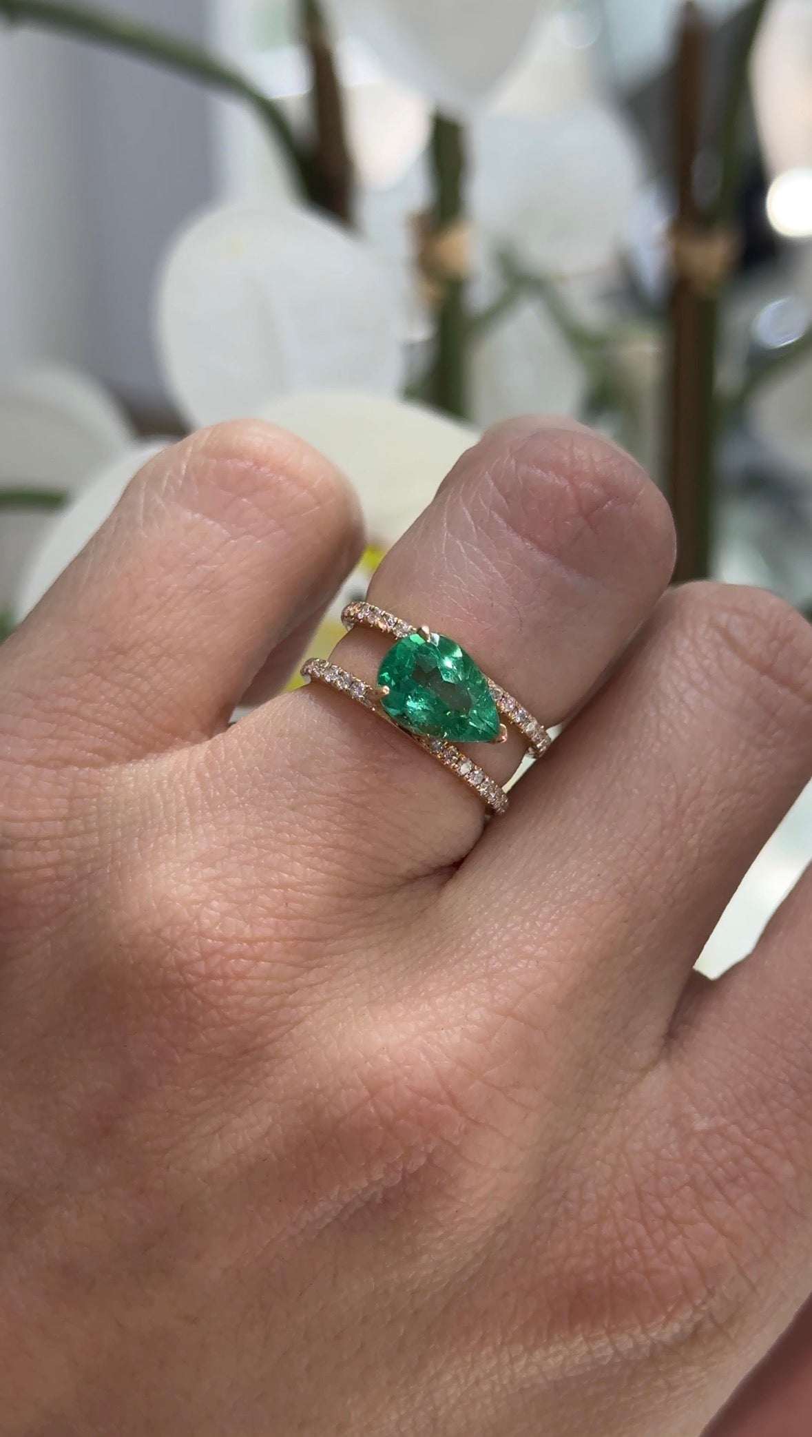 East to West Colombian emerald and diamond wide band ring in 18K gold, featuring a split shank design by JR Colombian Emeralds.