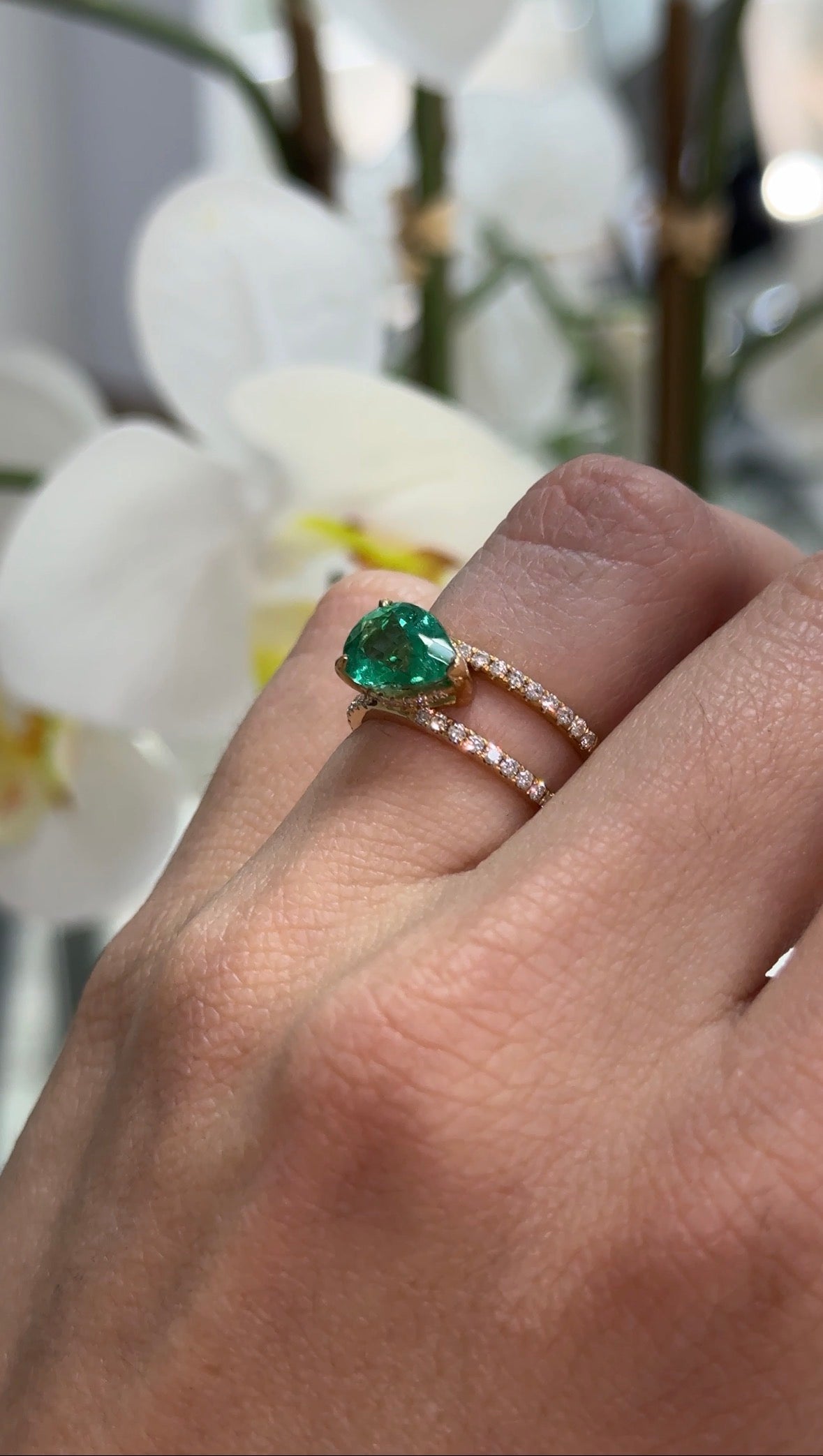 East to West Colombian emerald and diamond wide band ring in 18K gold, featuring a 2.29tcw split shank design by JR Colombian Emeralds.
