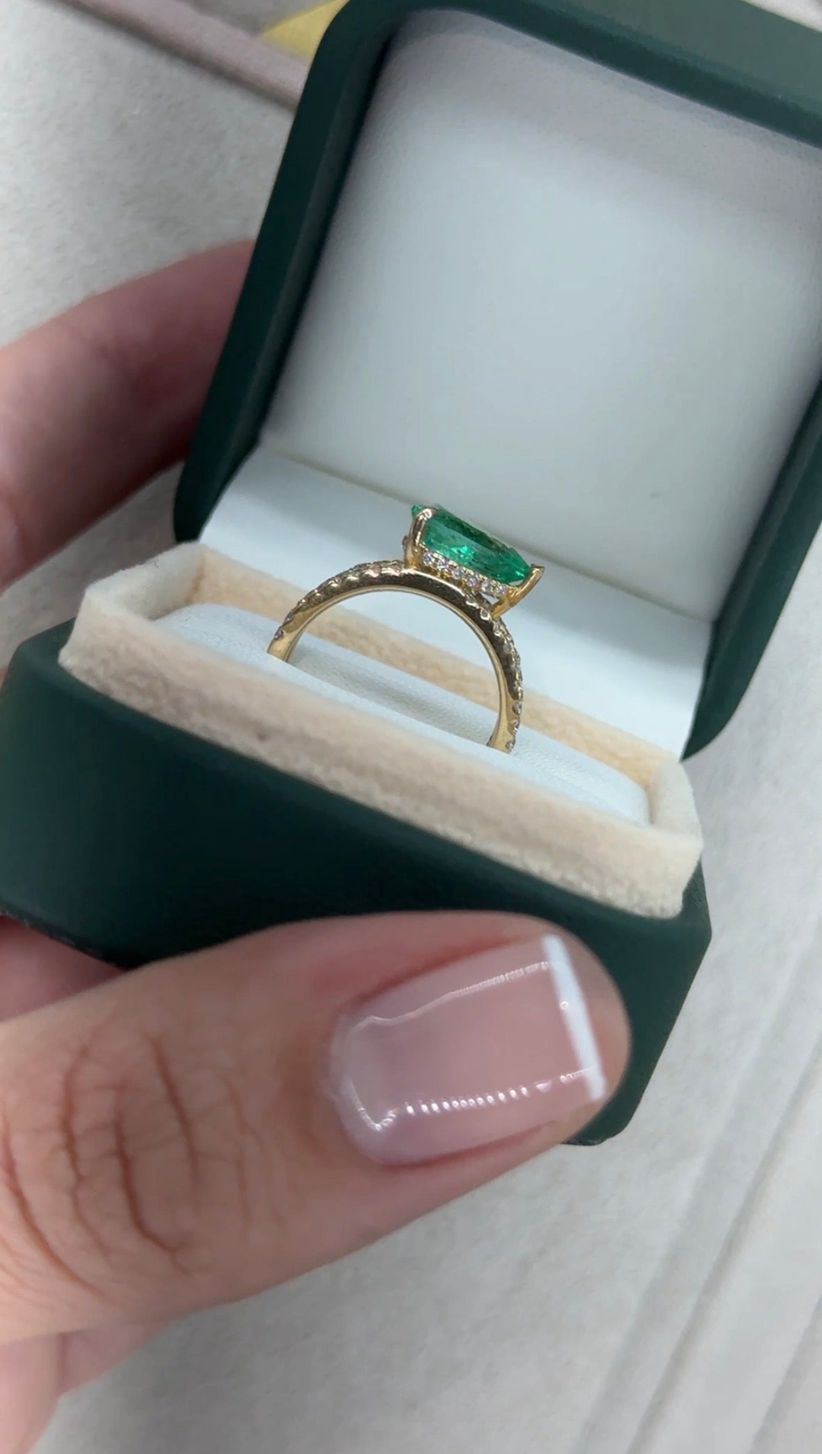 East to West Colombian emerald split shank diamond wide band ring in 18K gold by JR Colombian Emeralds.