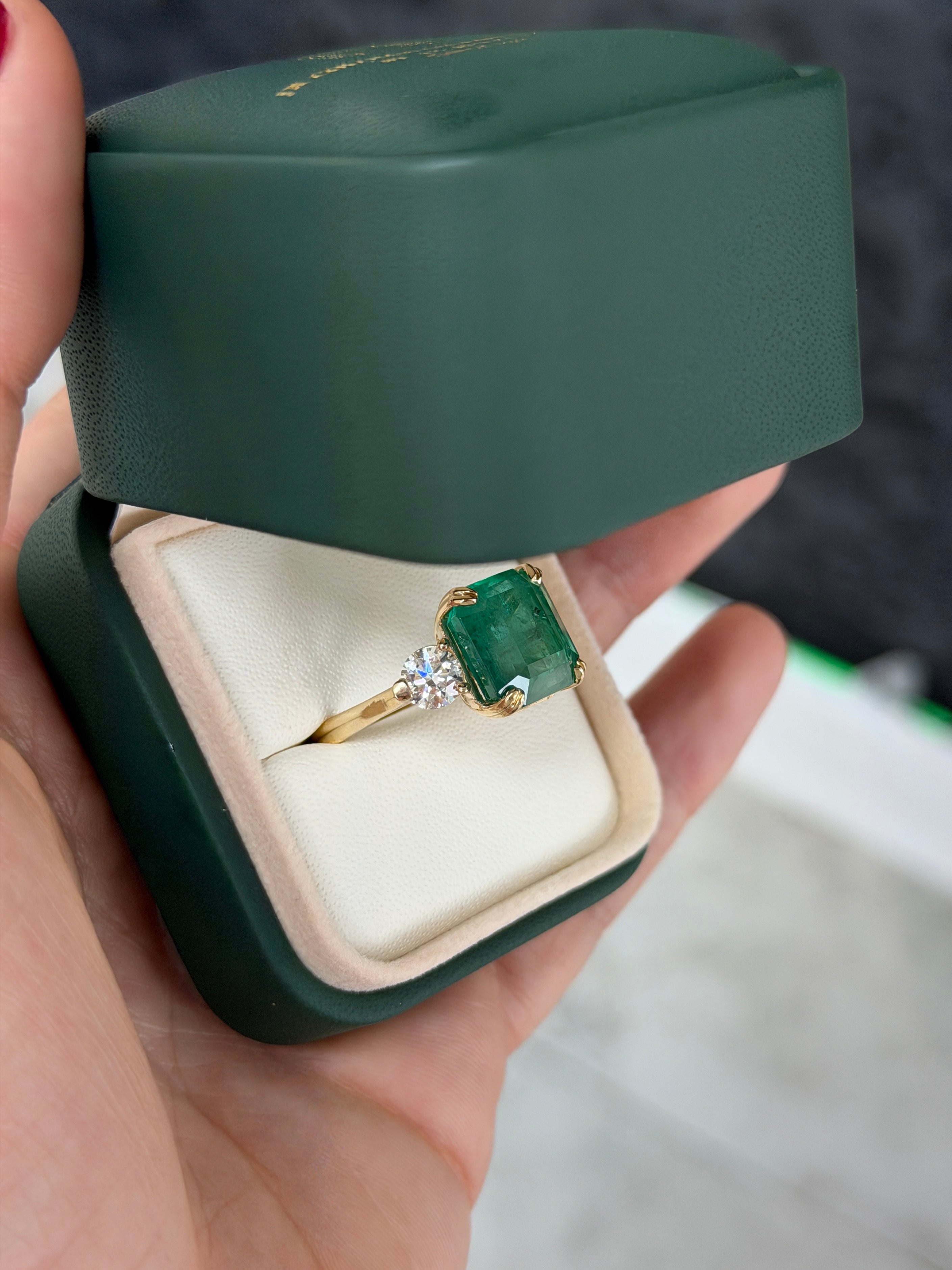 Three stone Asscher cut emerald engagement ring with round lab diamonds in 14K gold cathedral setting by JR Colombian Emeralds