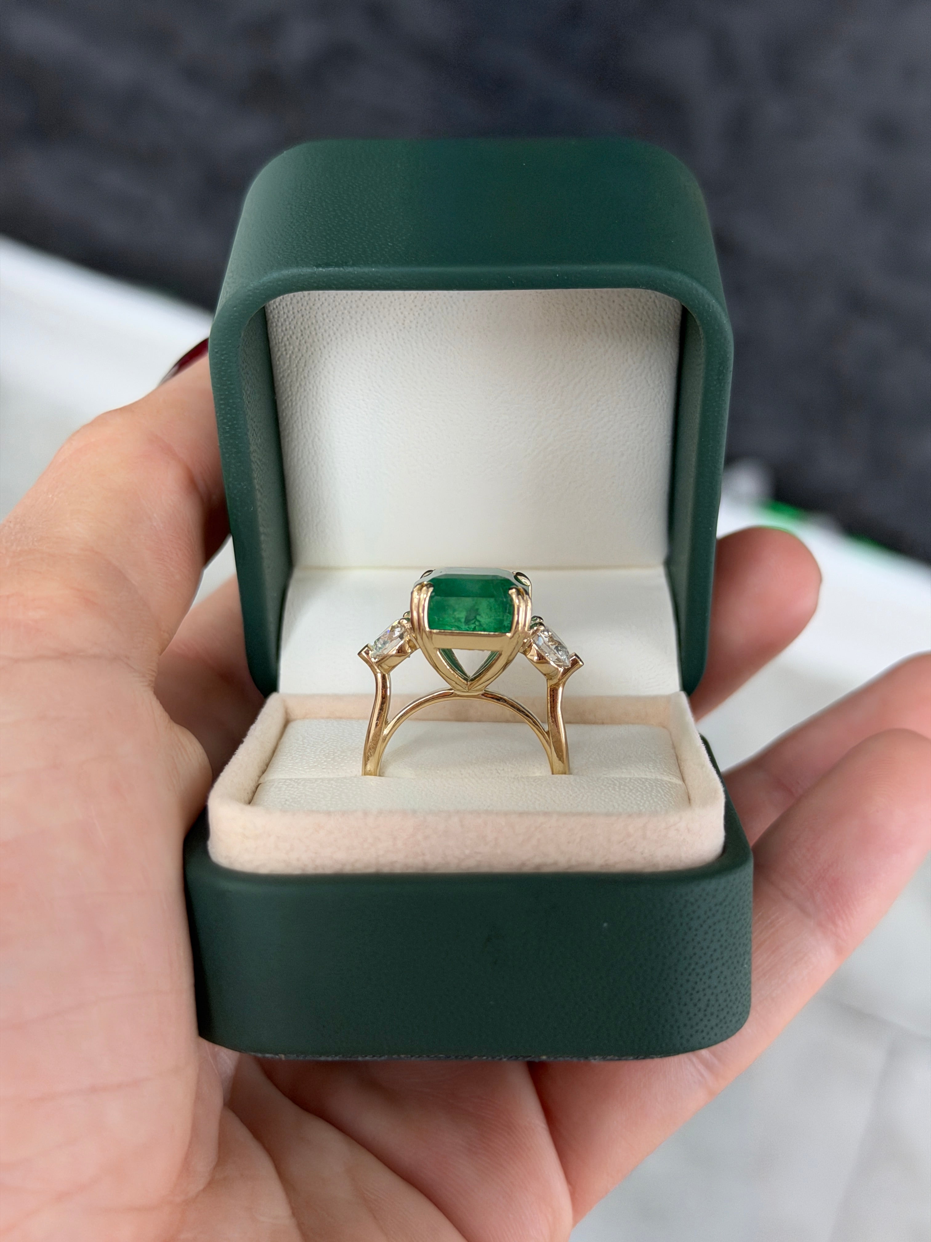 Three stone Asscher cut emerald engagement ring with round lab diamonds in 14K gold cathedral setting by JR Colombian Emeralds.