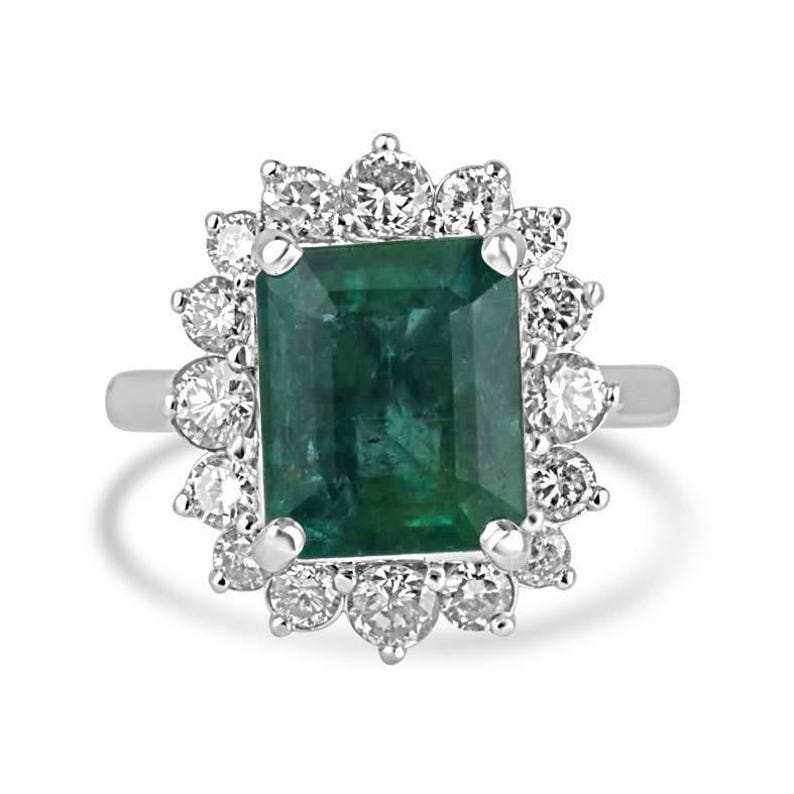 6.64tcw 14K white gold engagement ring with deep green emerald center and diamond halo