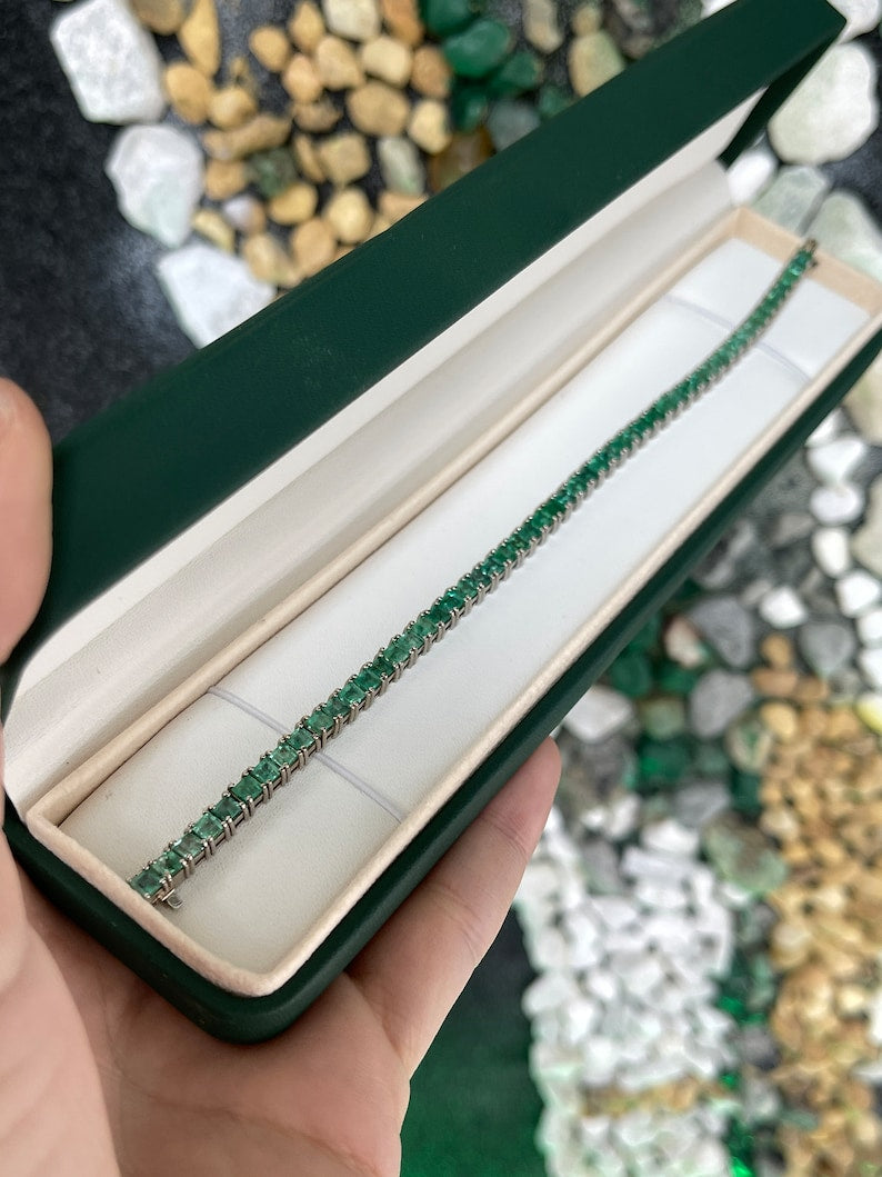 Unisex white gold tennis bracelet with medium green square princess cut emeralds, Colombian Emerald brand, 7.0 tcw.
