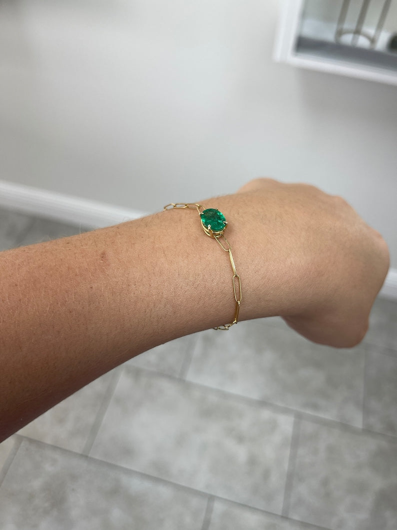 Colombian Emerald bracelet with 2.10ct oval cut natural green emerald, 14K gold paperclip design, four-prong east-west setting