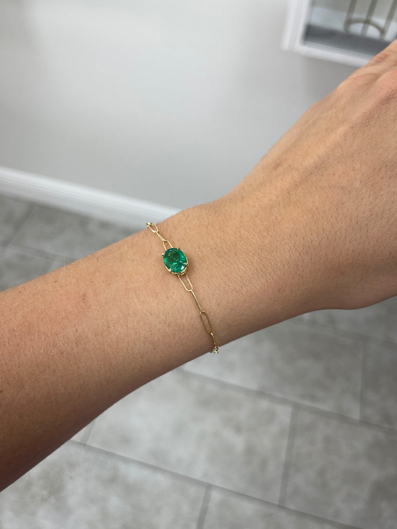 Colombian Emerald 14K gold bracelet with 2.10ct oval cut green emerald in a four-prong paperclip design, east-west style.