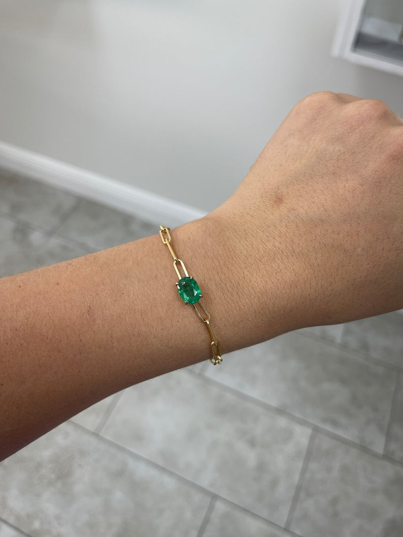 Colombian Emerald bracelet featuring 2.65ct oval cut natural emerald in a 14K gold paperclip style with four-prong setting.
