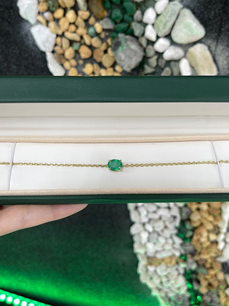 Vivid medium dark green 2.0ct Colombian Emerald unisex bracelet with oval cut stone and 14K gold four-prong setting on chain