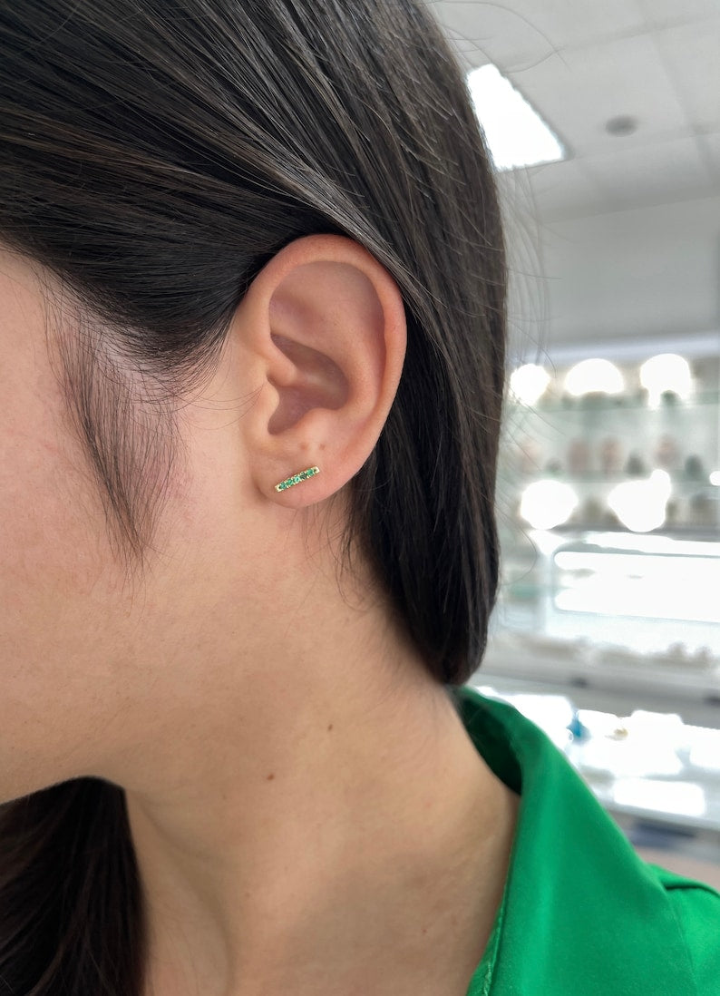 Colombian Emerald 0.20-carat vivid green natural emerald French set stacking earlobe bar earrings in 14K gold.
