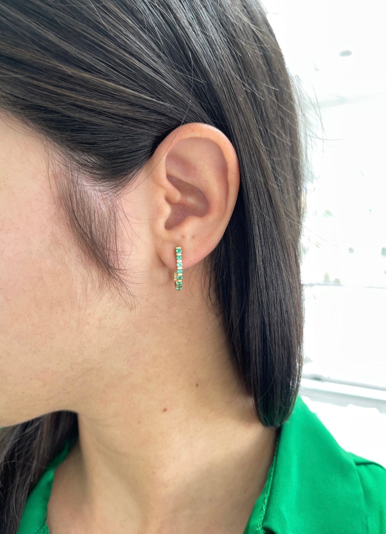 Natural round emerald half J-hoop earrings in 14K yellow gold with 0.75 total carat weight from Colombian Emerald.