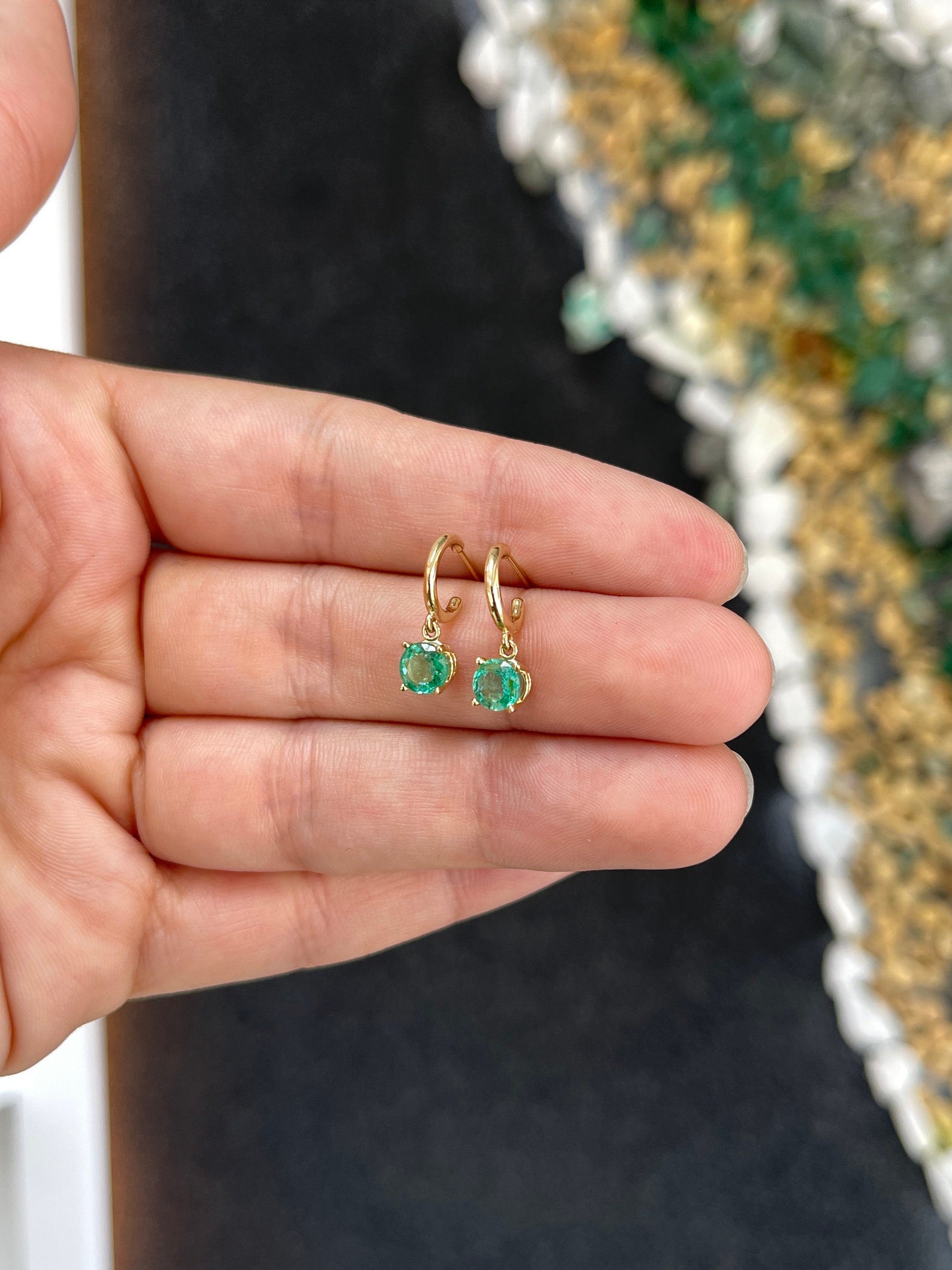 Medium dark green emerald round cut hoop earrings with four prongs, 14K gold, by Colombian Emerald.