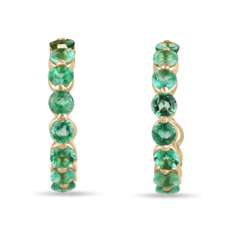 14K yellow gold Colombian Emerald earrings with round-cut green emeralds in a prong-set half hoop design.