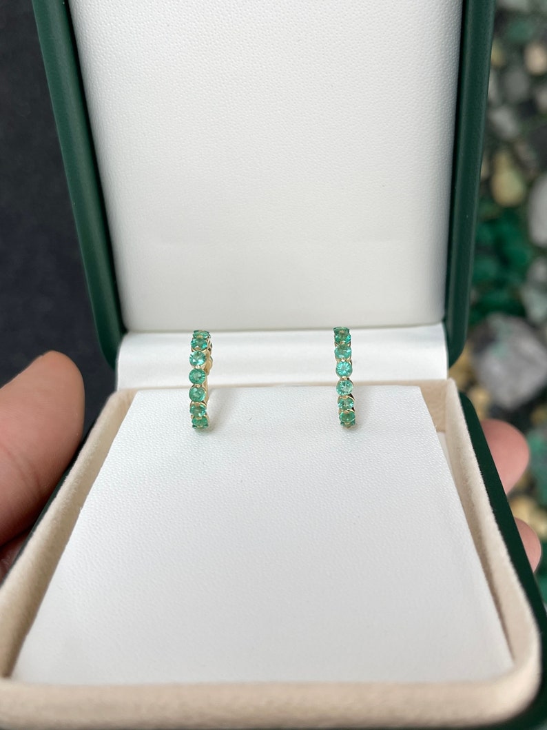 Colombian Emerald 14K yellow gold half hoop earrings with 1.50tcw round cut green emeralds in prong settings