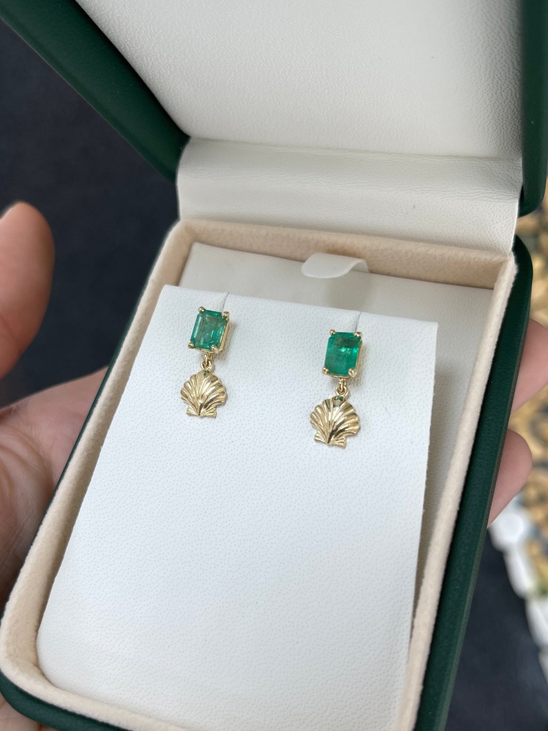 Colombian Emerald 14K gold dangle stud earrings with ocean sea shell design and 1.90tcw emeralds, crafted for elegant style.