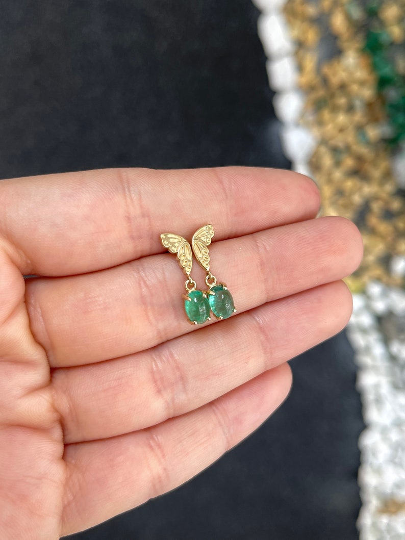 Colombian Emerald 14K yellow gold dangle earrings with 2.05tcw oval cut green cabochon emeralds and half butterfly design